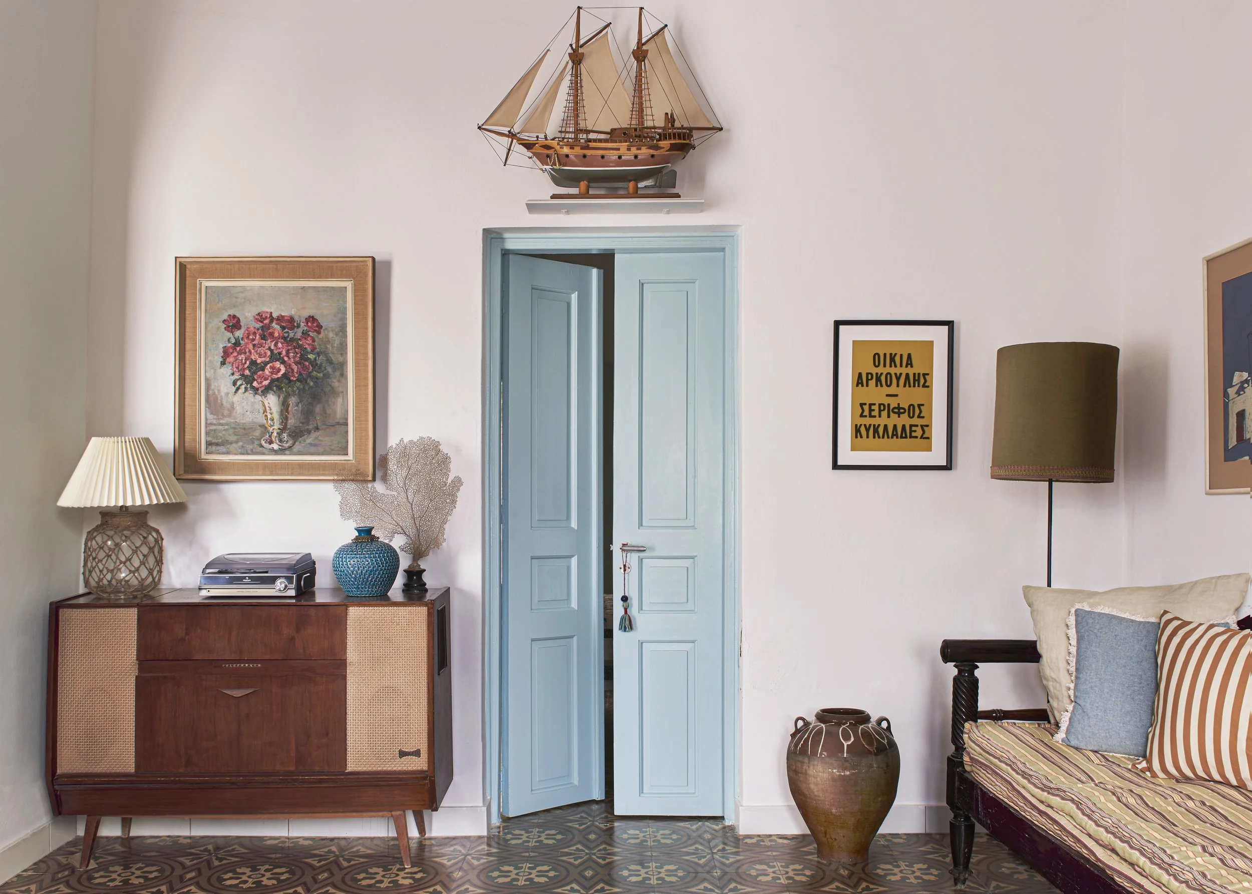 Hallway of a Greek Island House using a combination of local, vintage and modern furniture and items, designed by Howark.