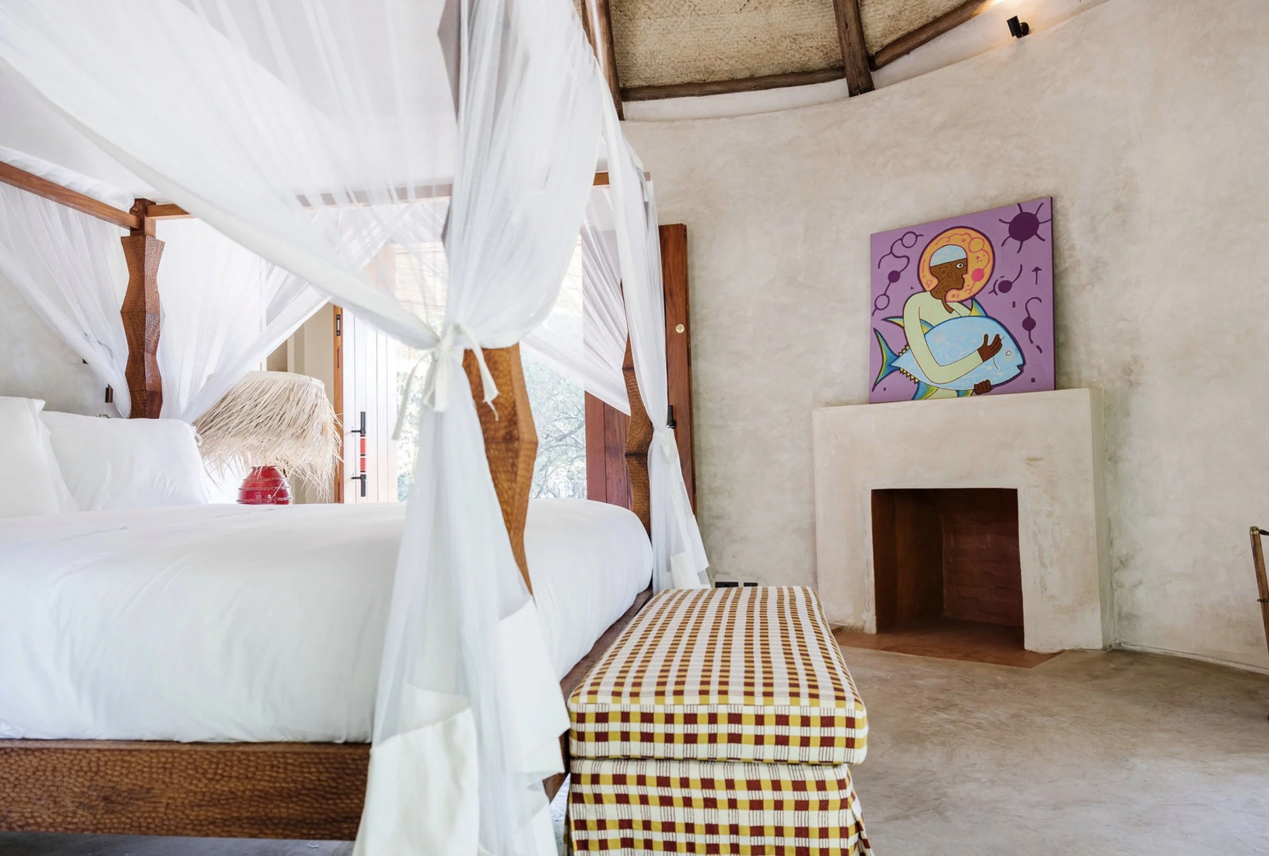 Colorful interior of a master bedroom in a Private Lodge in Kenya, designed by Howark and crafted by local artisans.