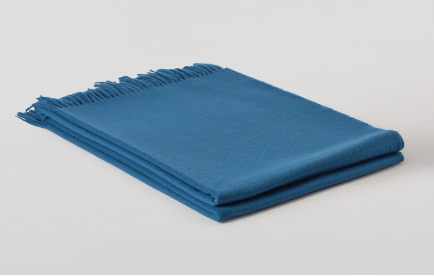 Bright. blue cashmere throw