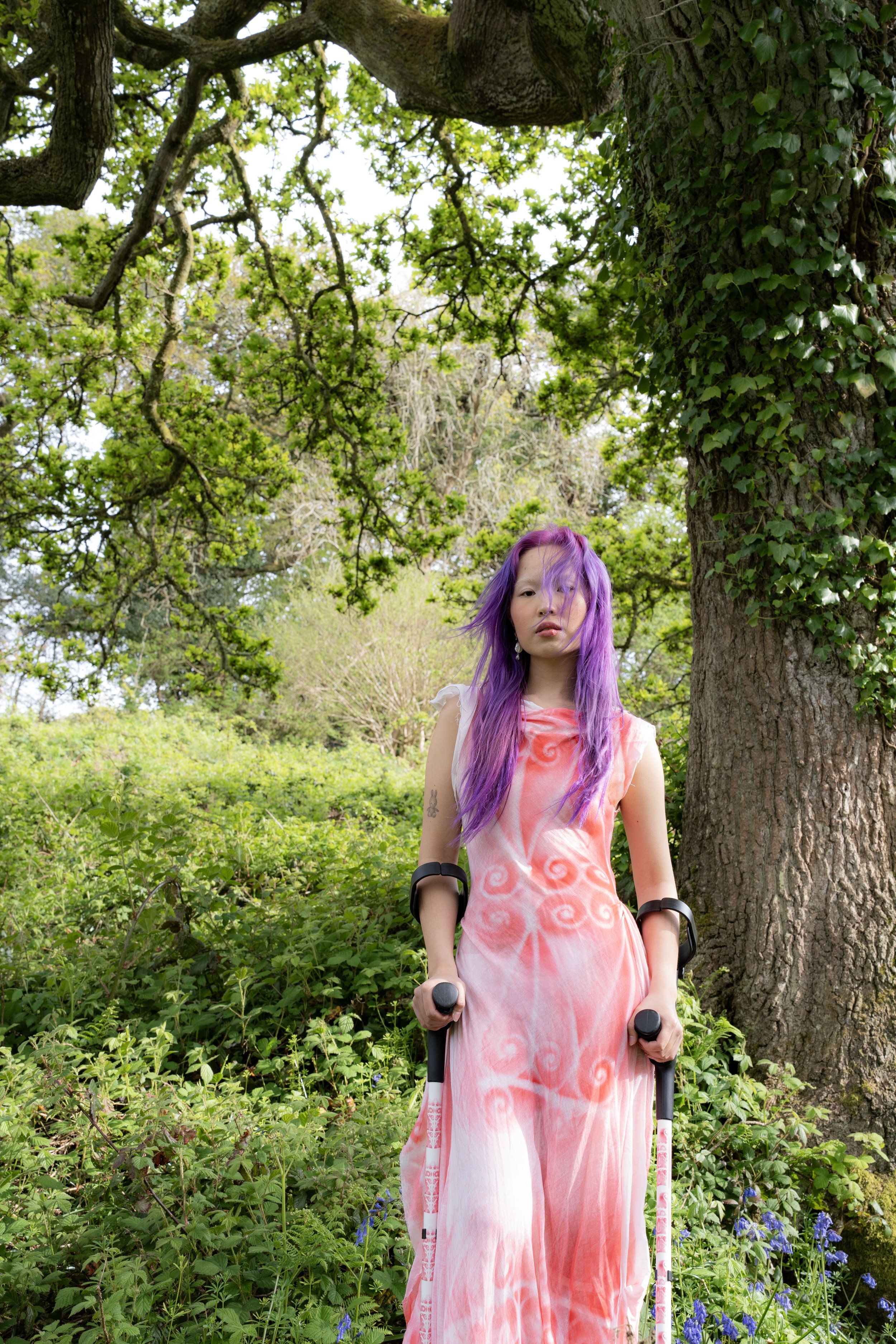 Portrait of Josie Tang with crutches