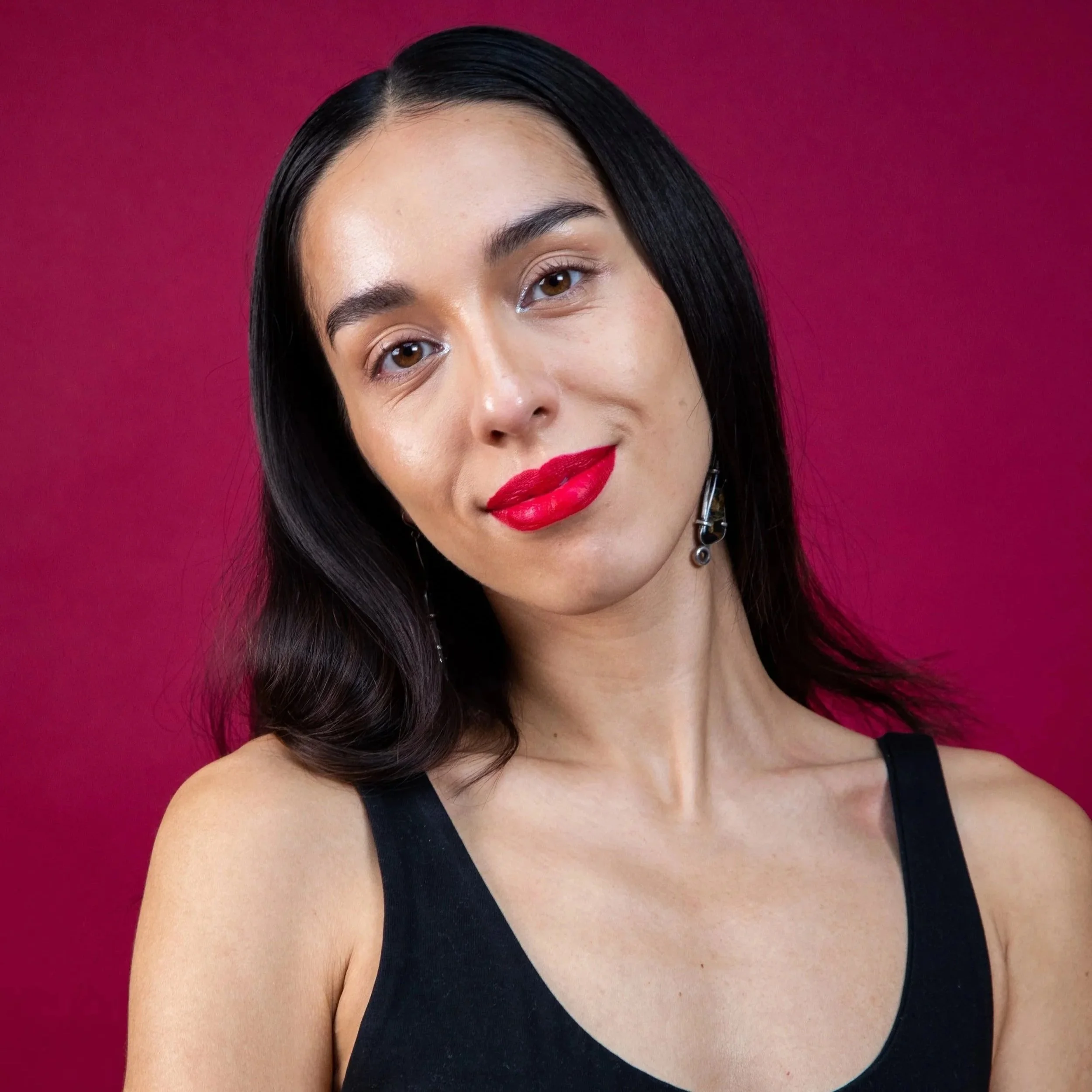 Portrait of Claudia Rose Walder Martinez - red backdrop