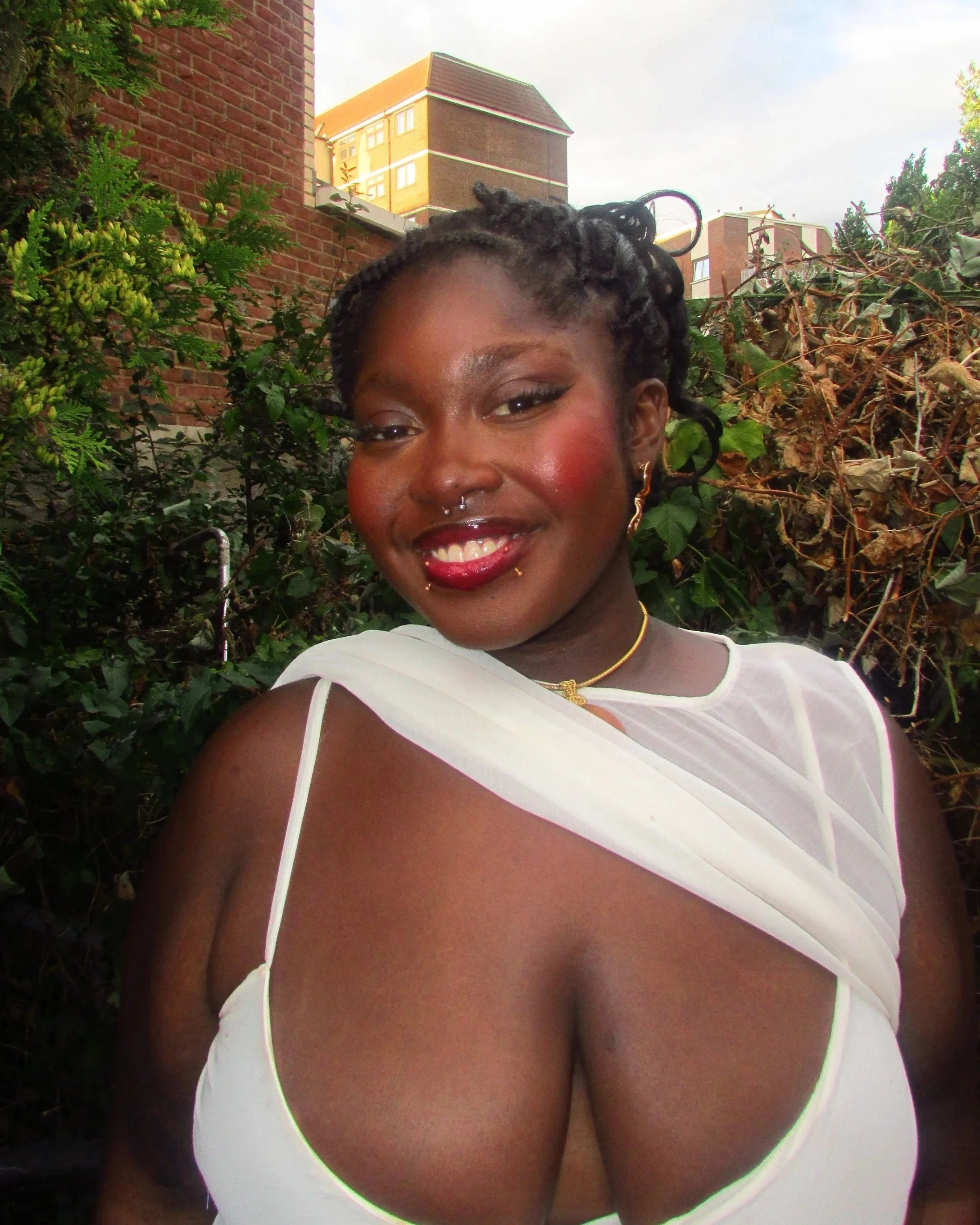 Portrait of Ola Oguntuase - white dress