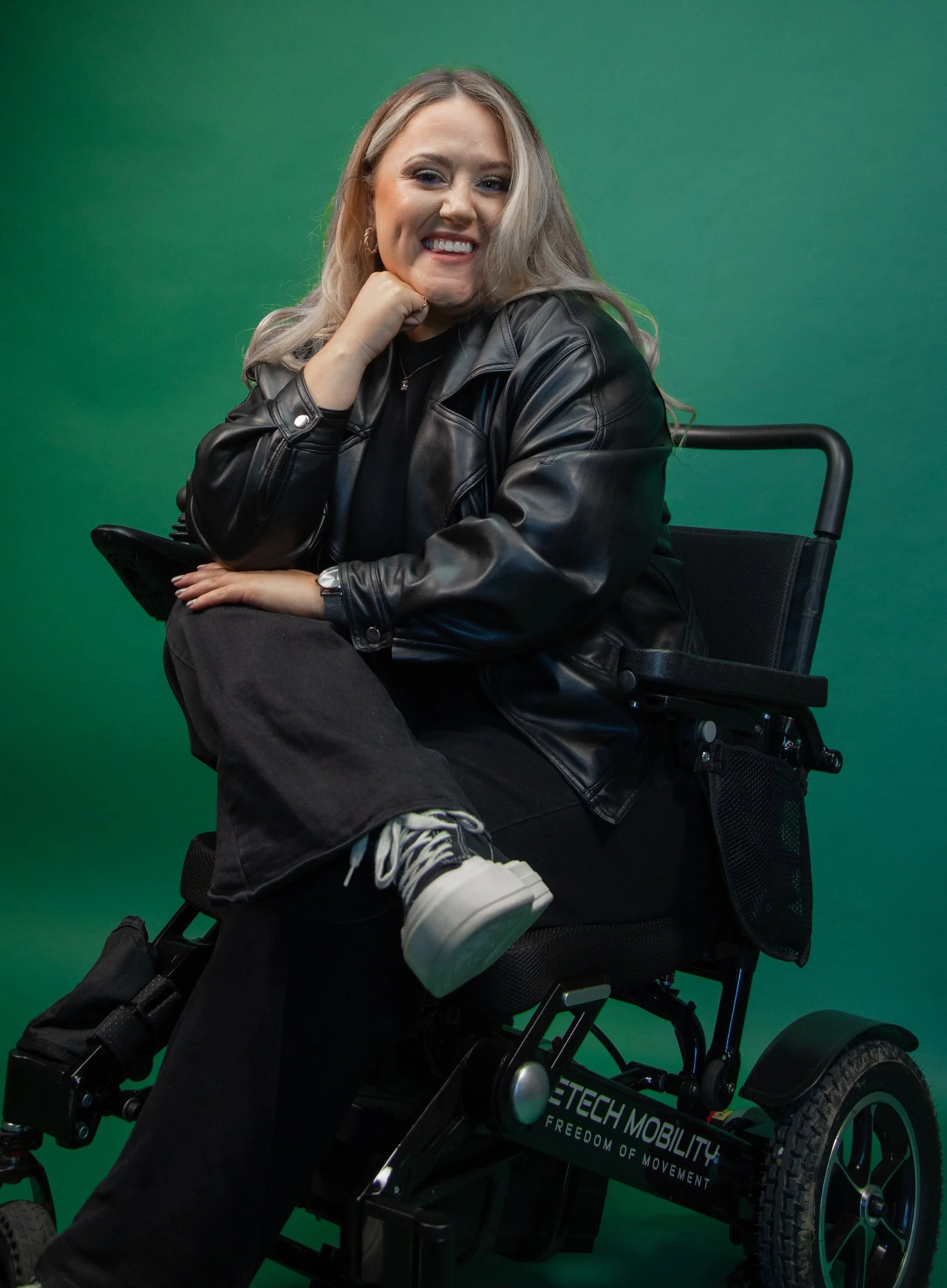 Simone sitting in her powerchair