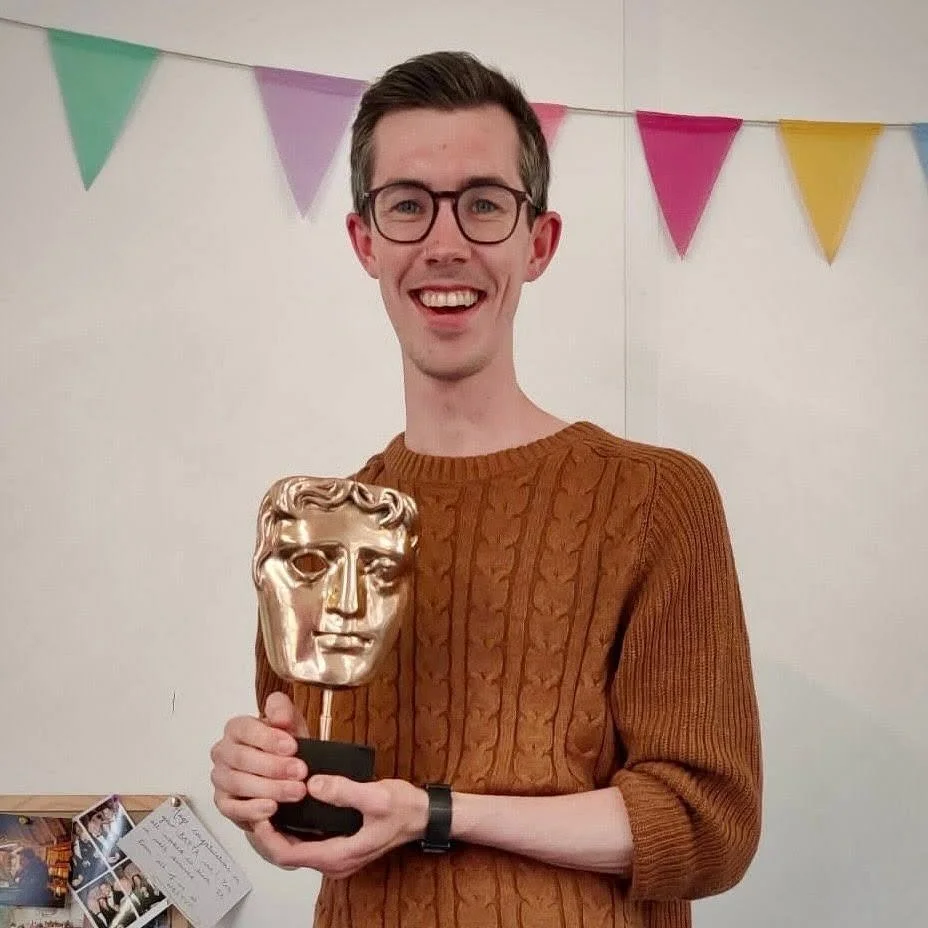 Portrait of Ayrton McGurgan holding a BAFTA