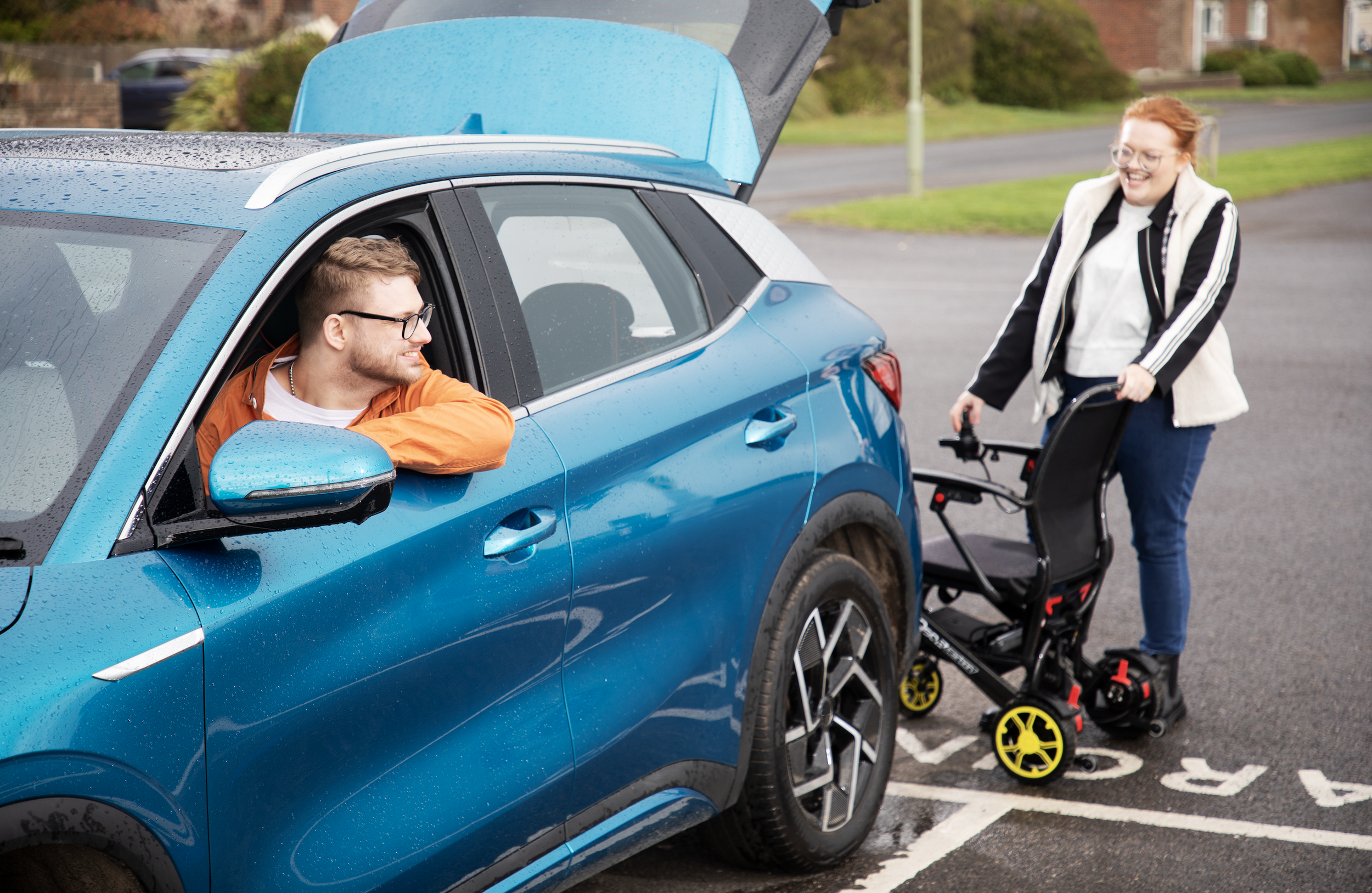 Campaign shot of Alex MacKenzie in Motability Car