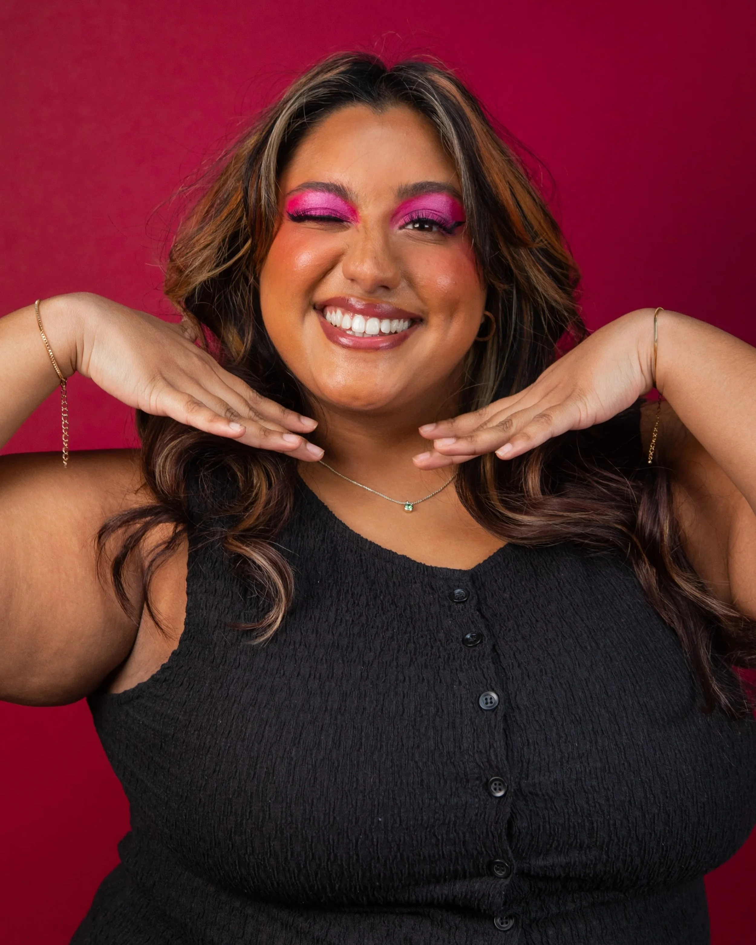 Portrait of Shareena Emambocus - red backdrop