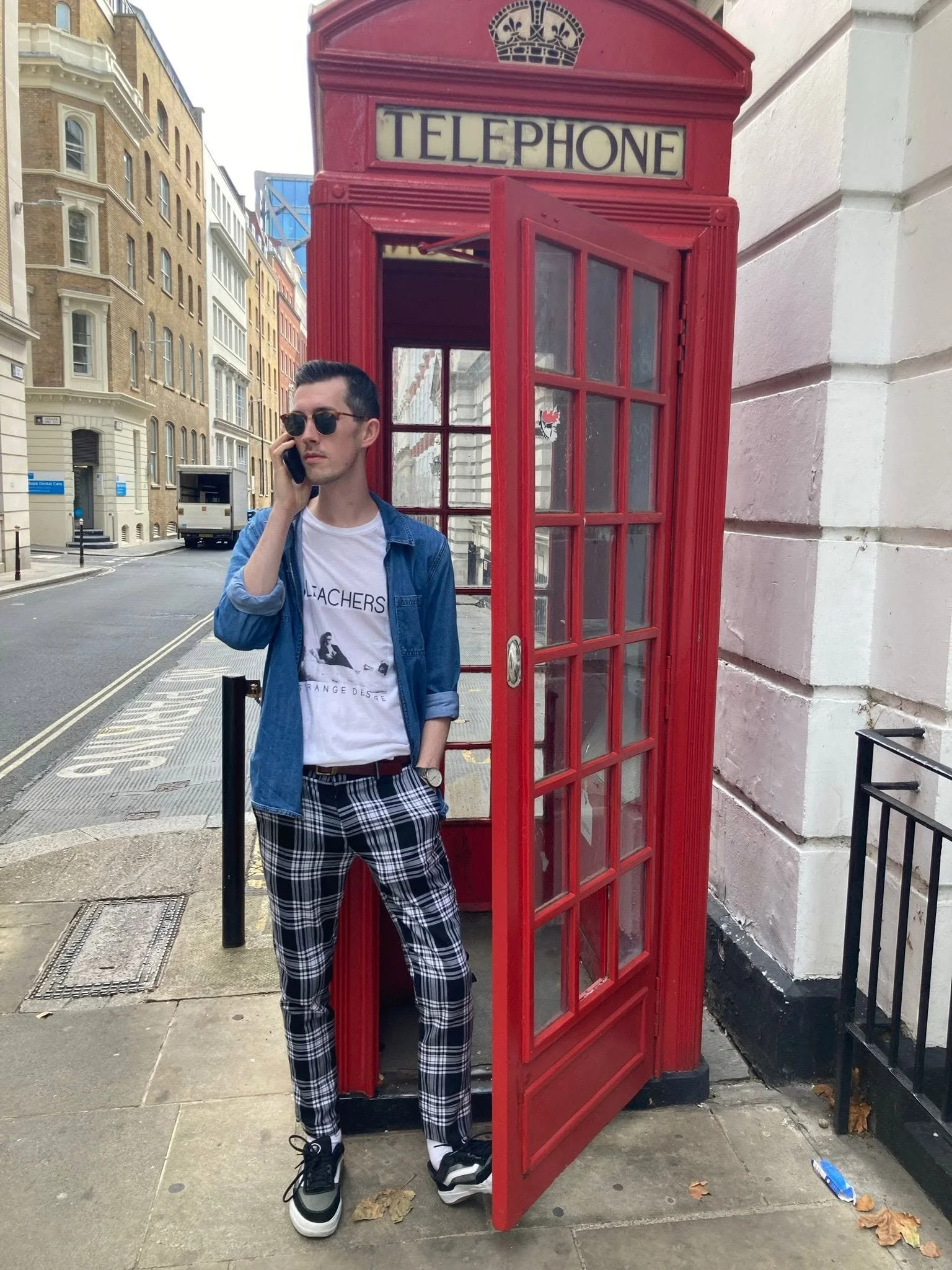 Portrait of Ayrton McGurgan in telephone box