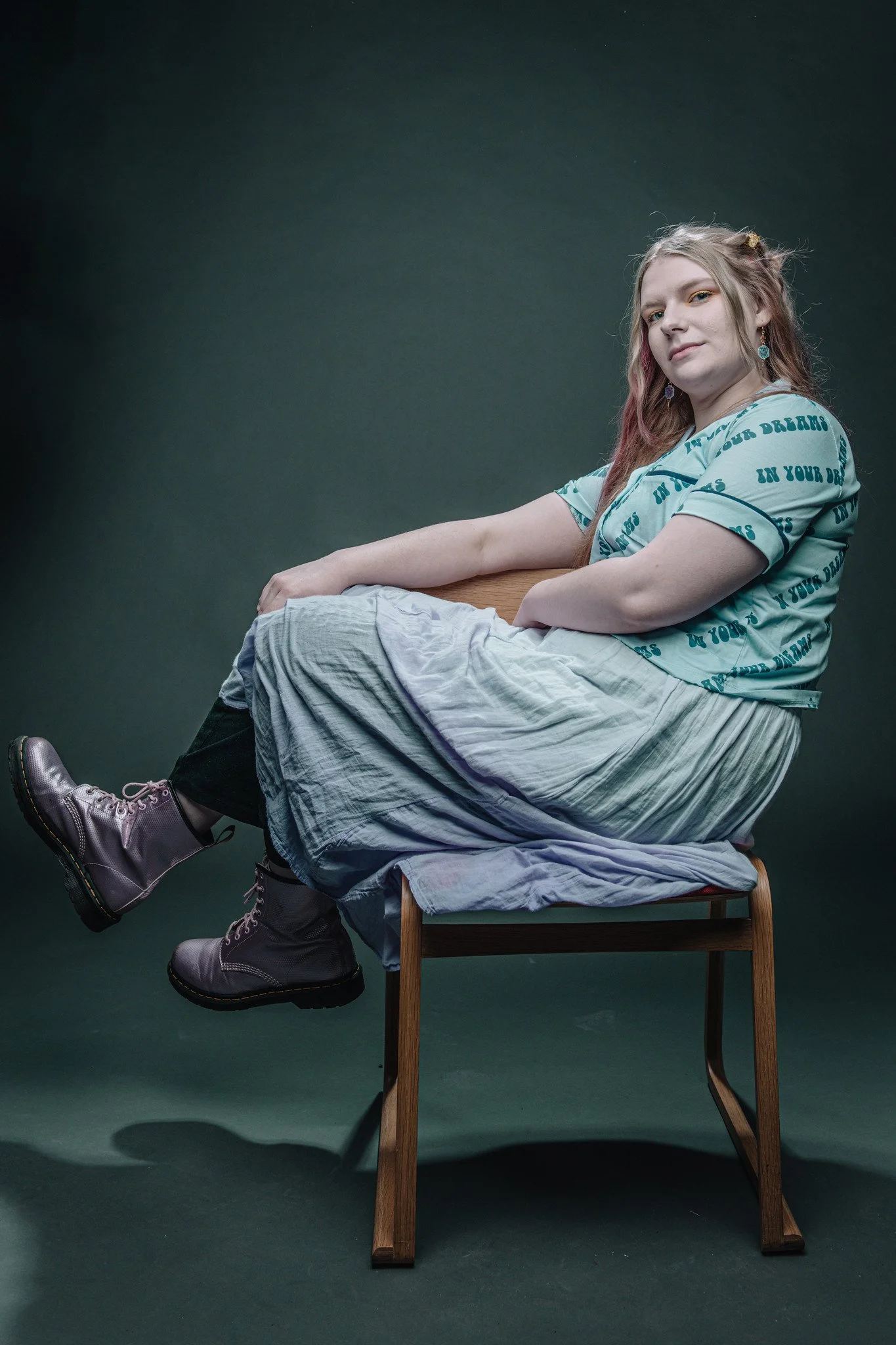 Portrait of Lily Beatrice sat on chair