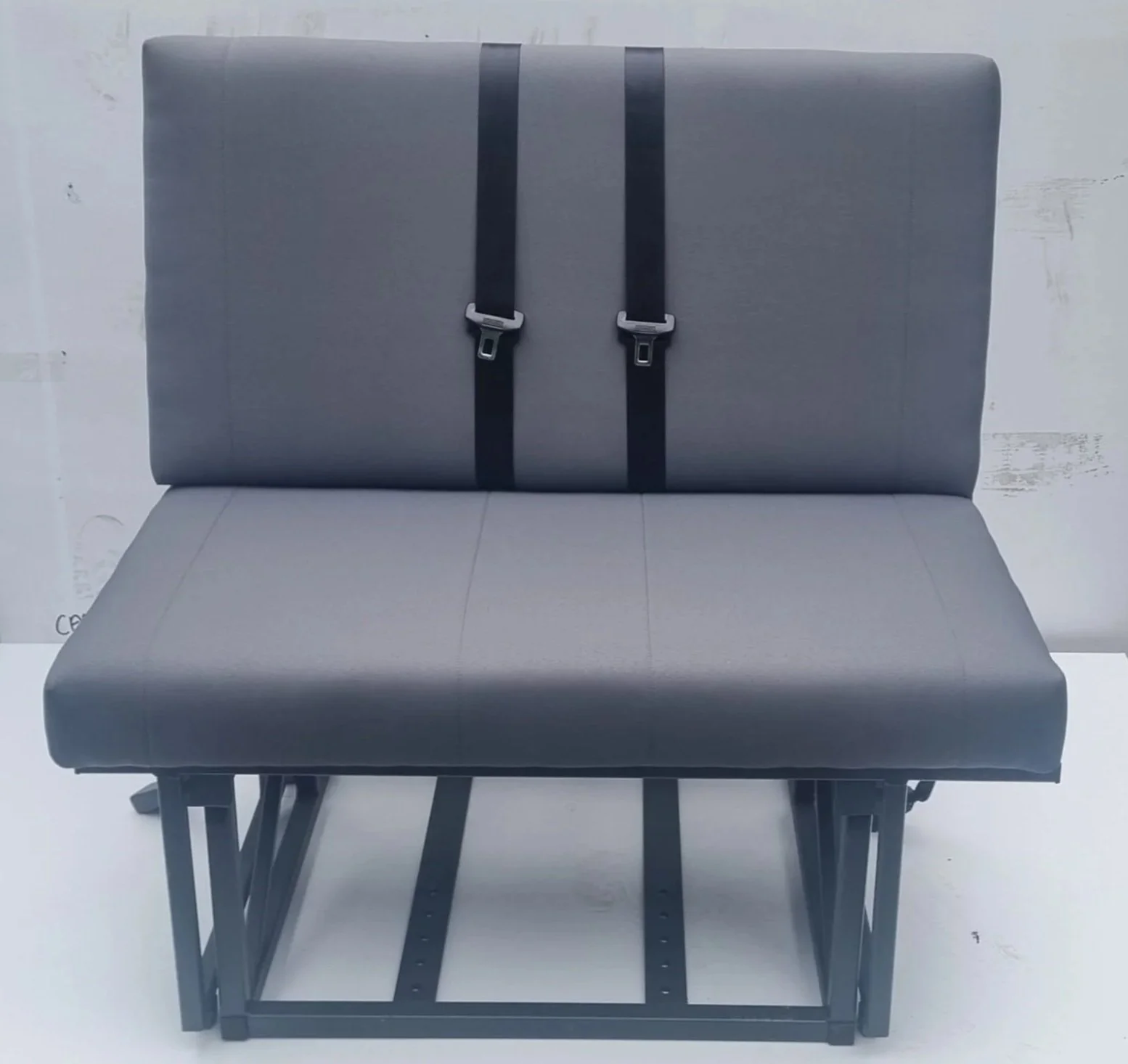 Rock and roll metal pull-out bed frame with grey stitched cushions