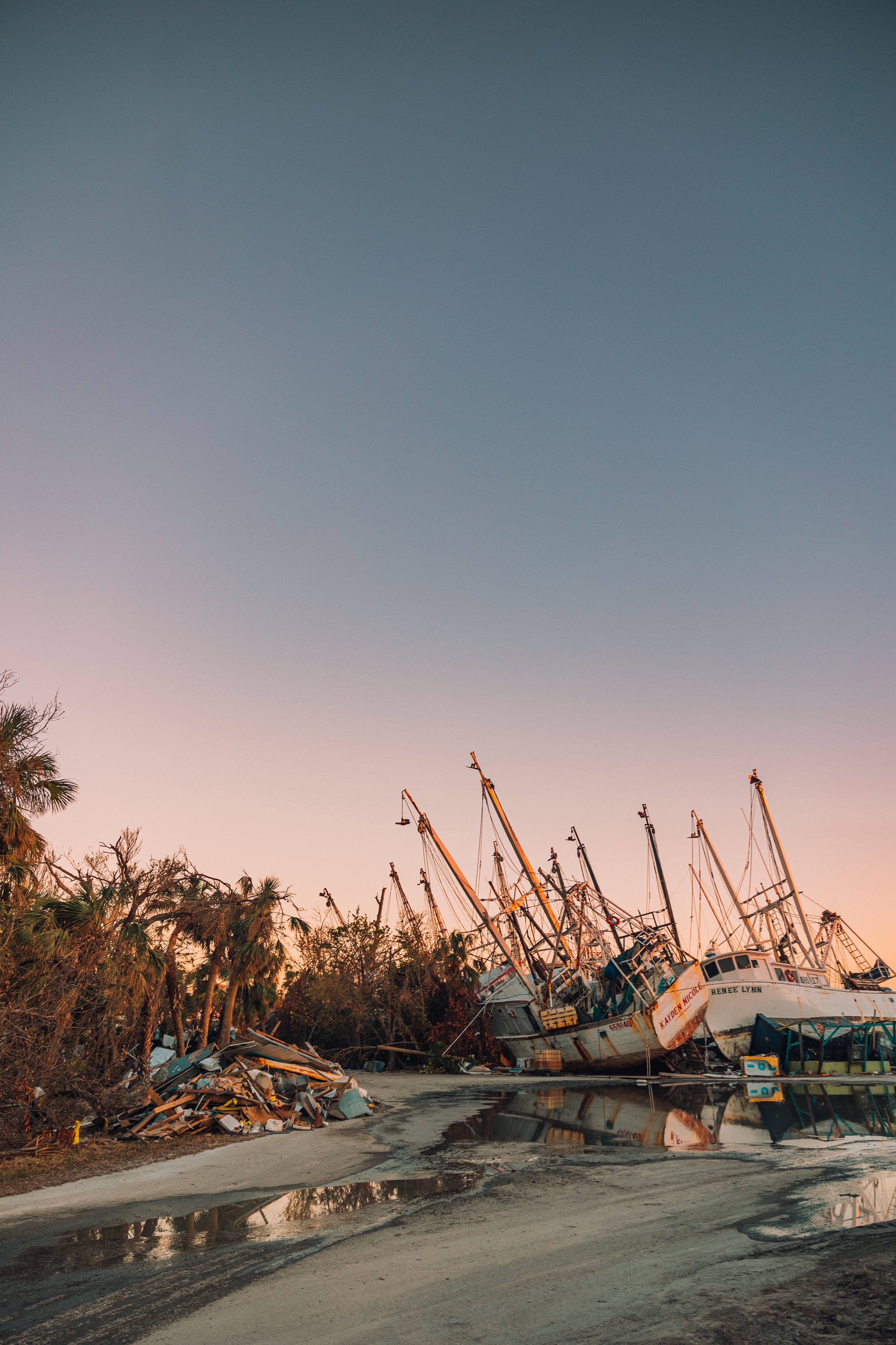 shrimping boats on the land after Hurricane Ian damage in Fort Lauderdale, Florida