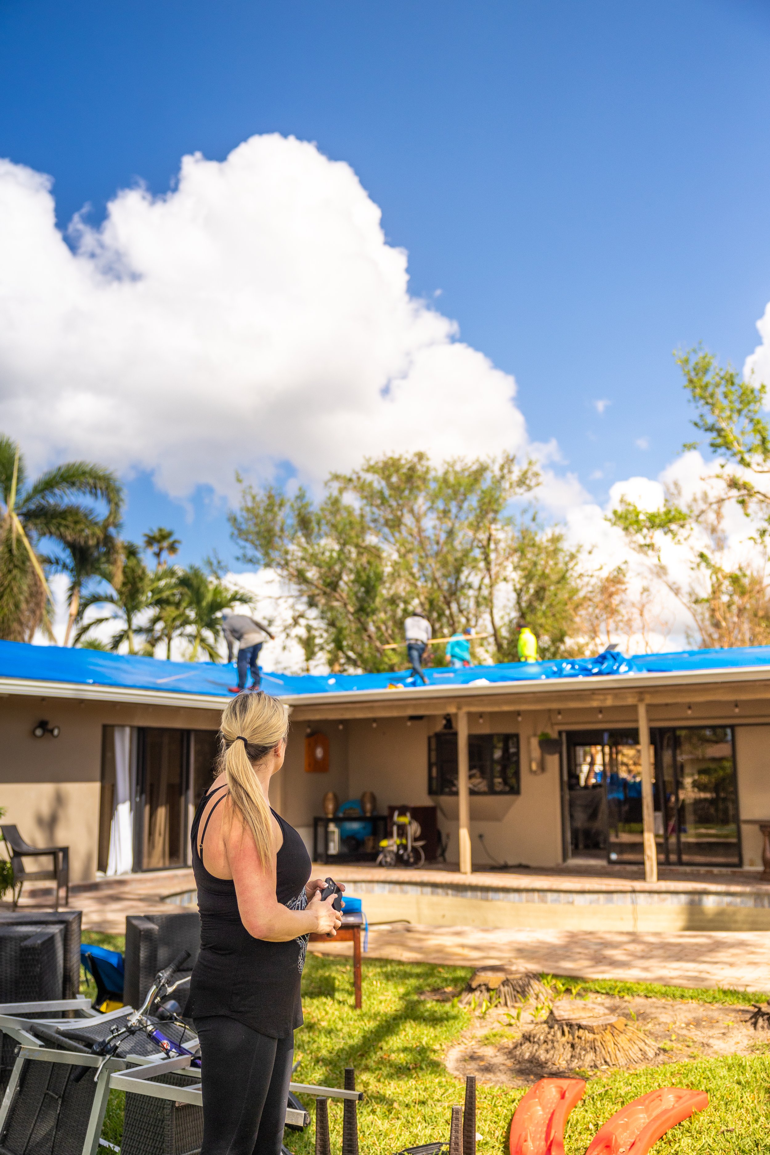Portrait of woman in her front yard after Hurricane Ian damage in Fort Lauderdale, Florida