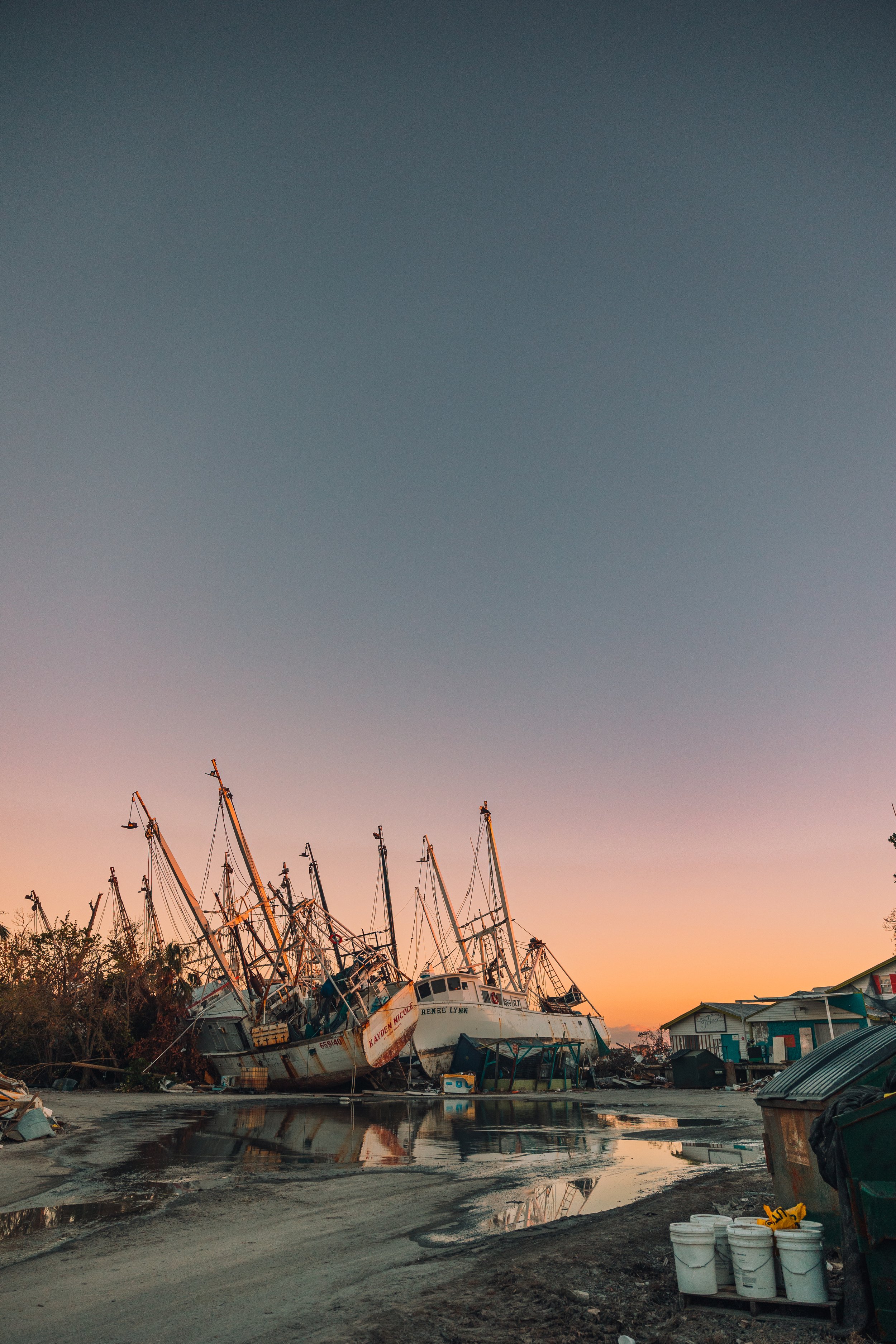 shrimping boats on the land after Hurricane Ian damage in Fort Lauderdale, Florida