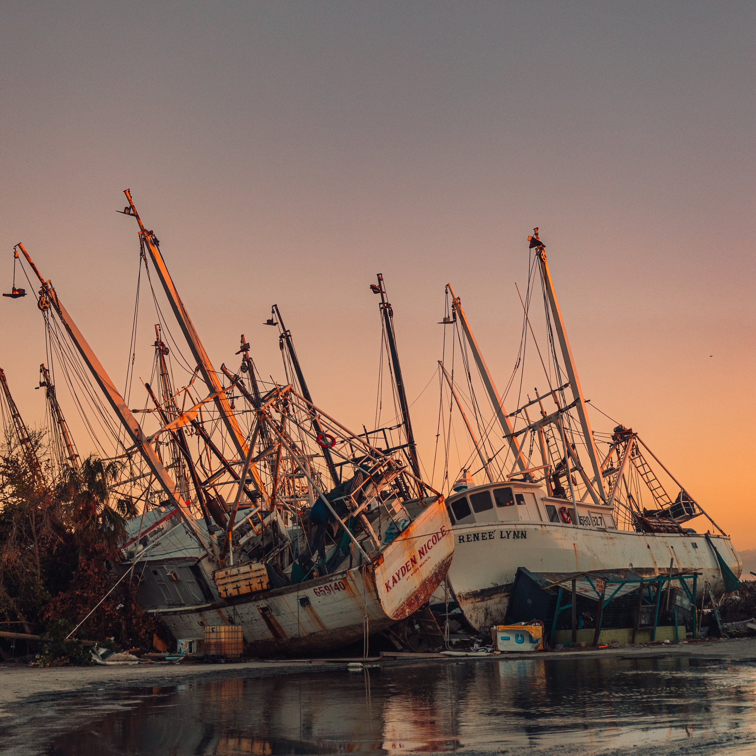 shrimping boats on the land after Hurricane Ian damage in Fort Lauderdale, Florida