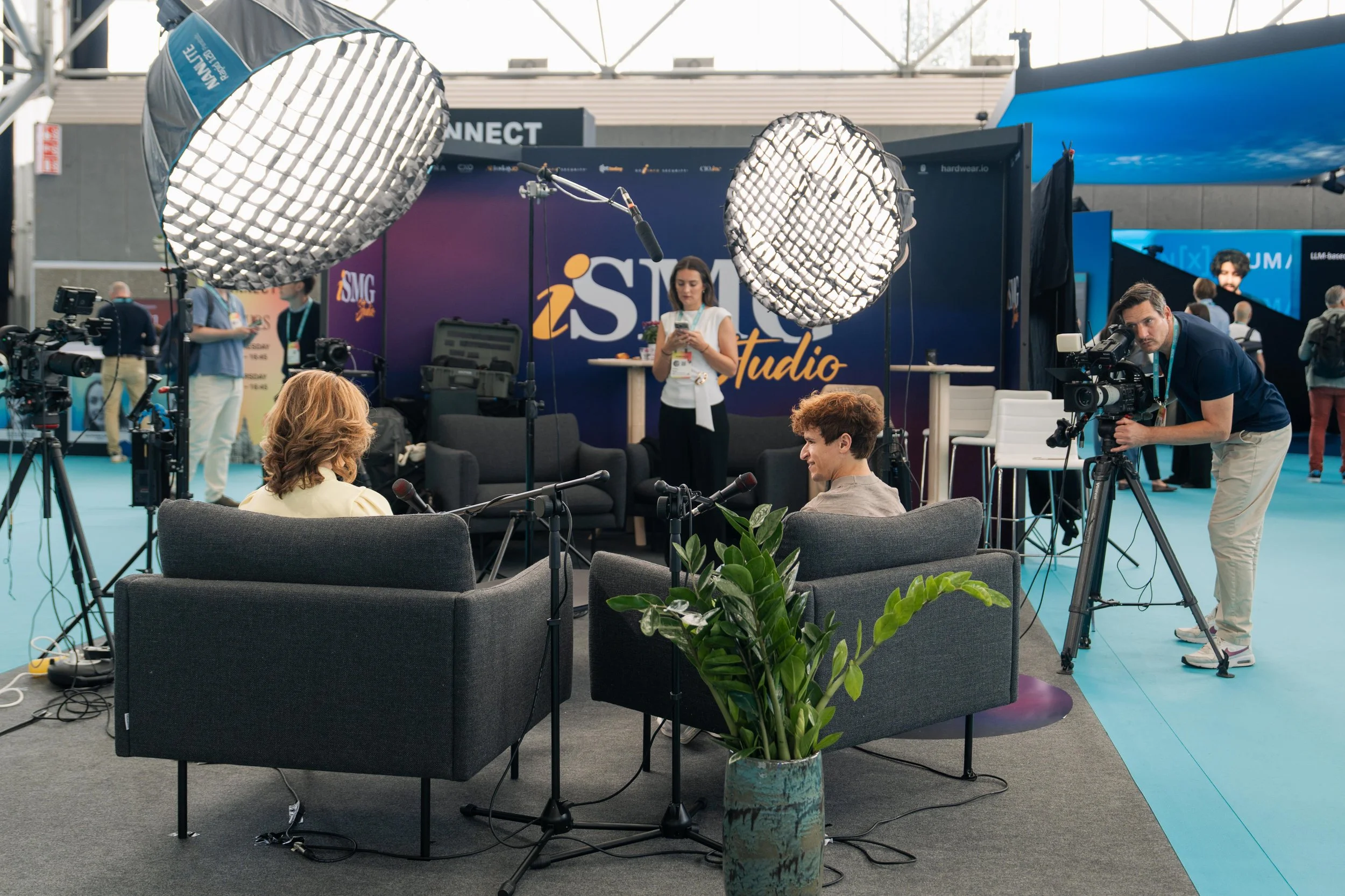 Three-camera podcast set with studio lighting on the Human X expo floor at RAI Amsterdam