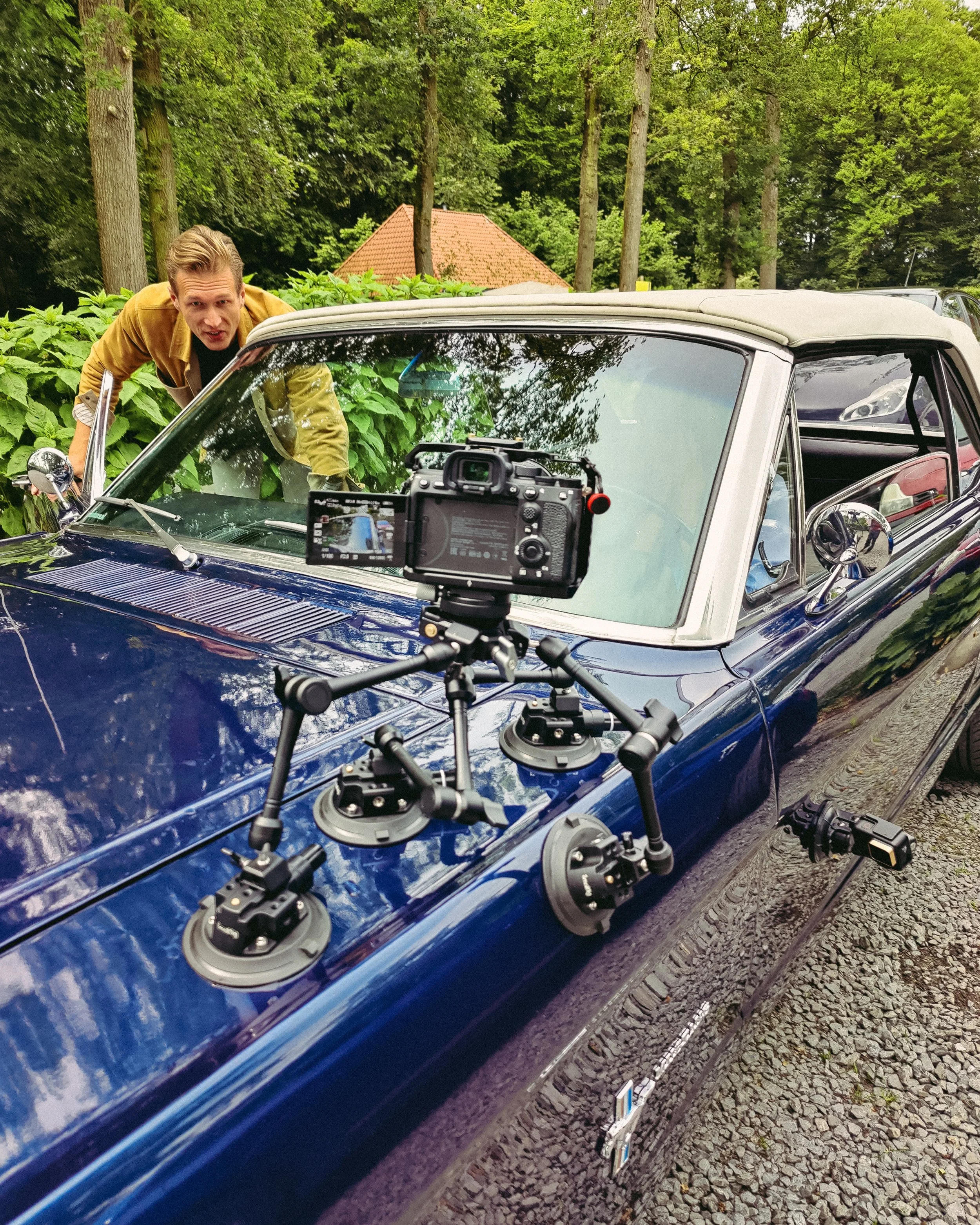 filming on location with camera mounted to a car
