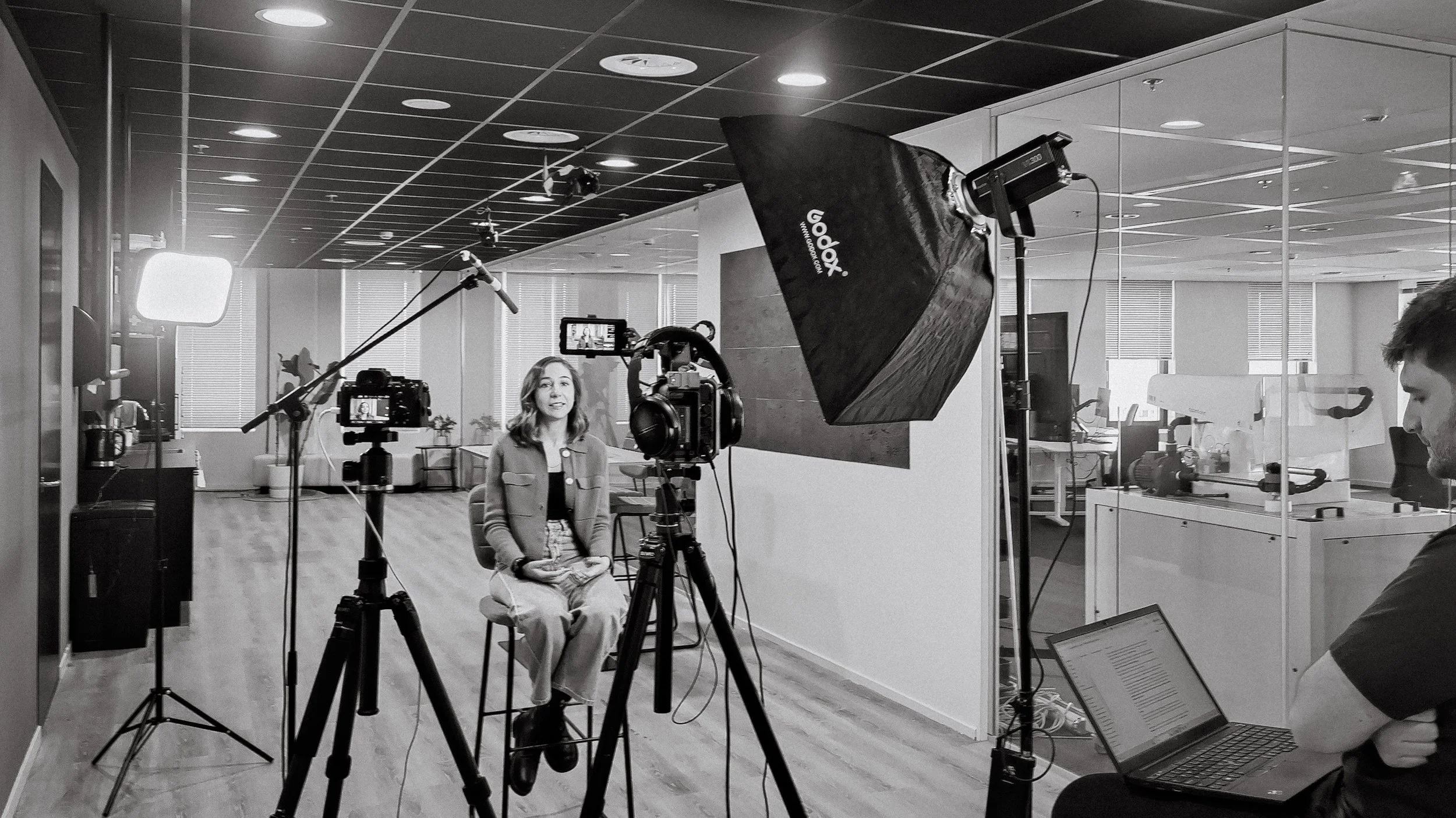 Freelance cameraman filming a corporate video