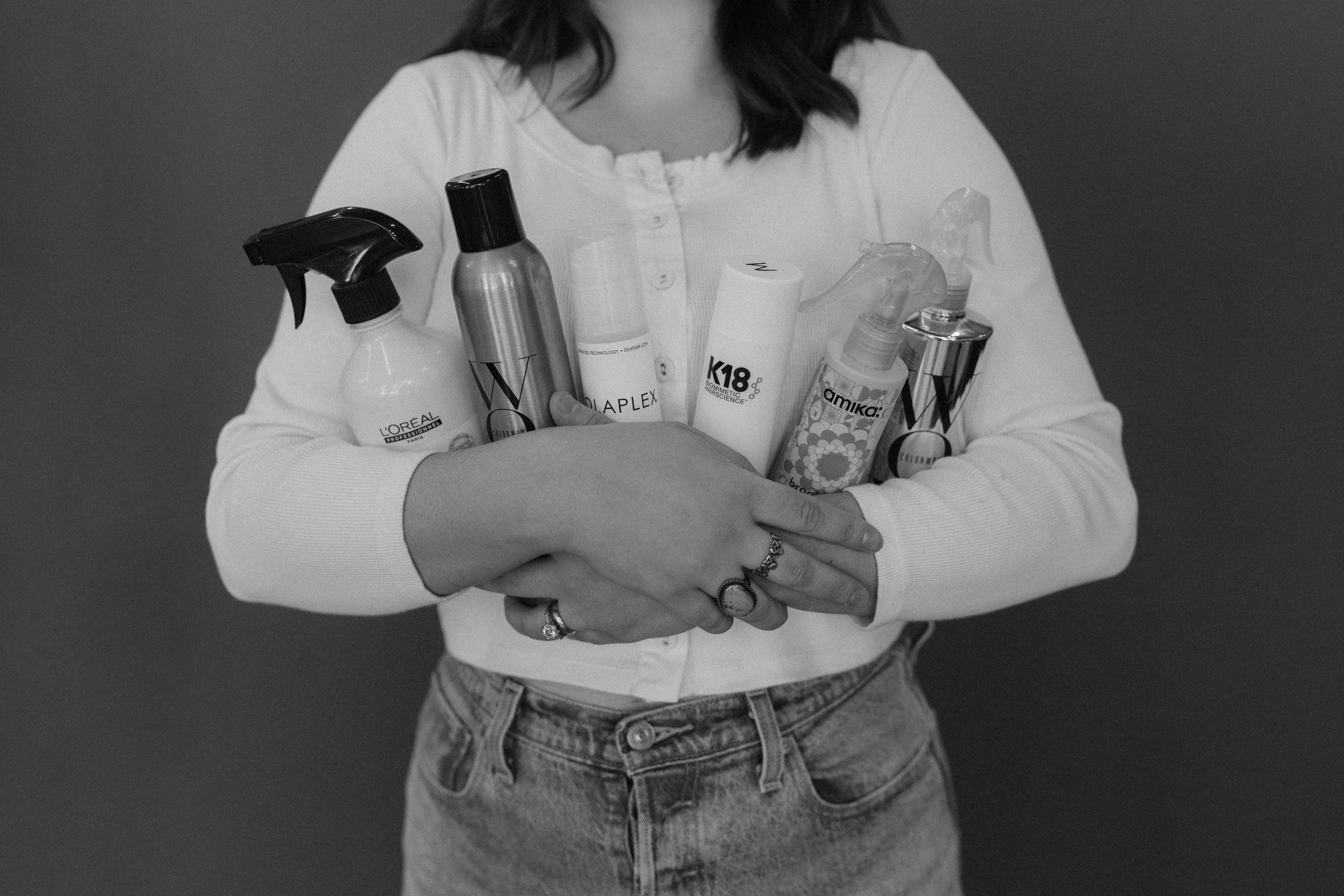 products and stylist holding them