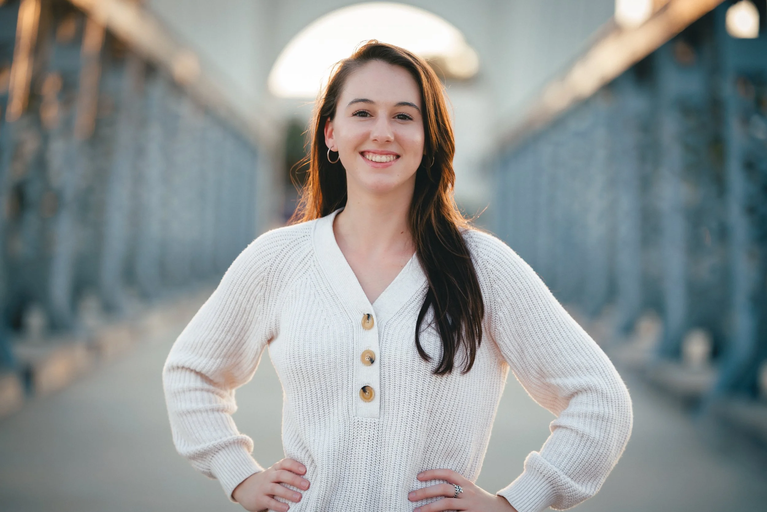 Photo of a female agent in Waco Texas posing on the Waco Suspension Bridge