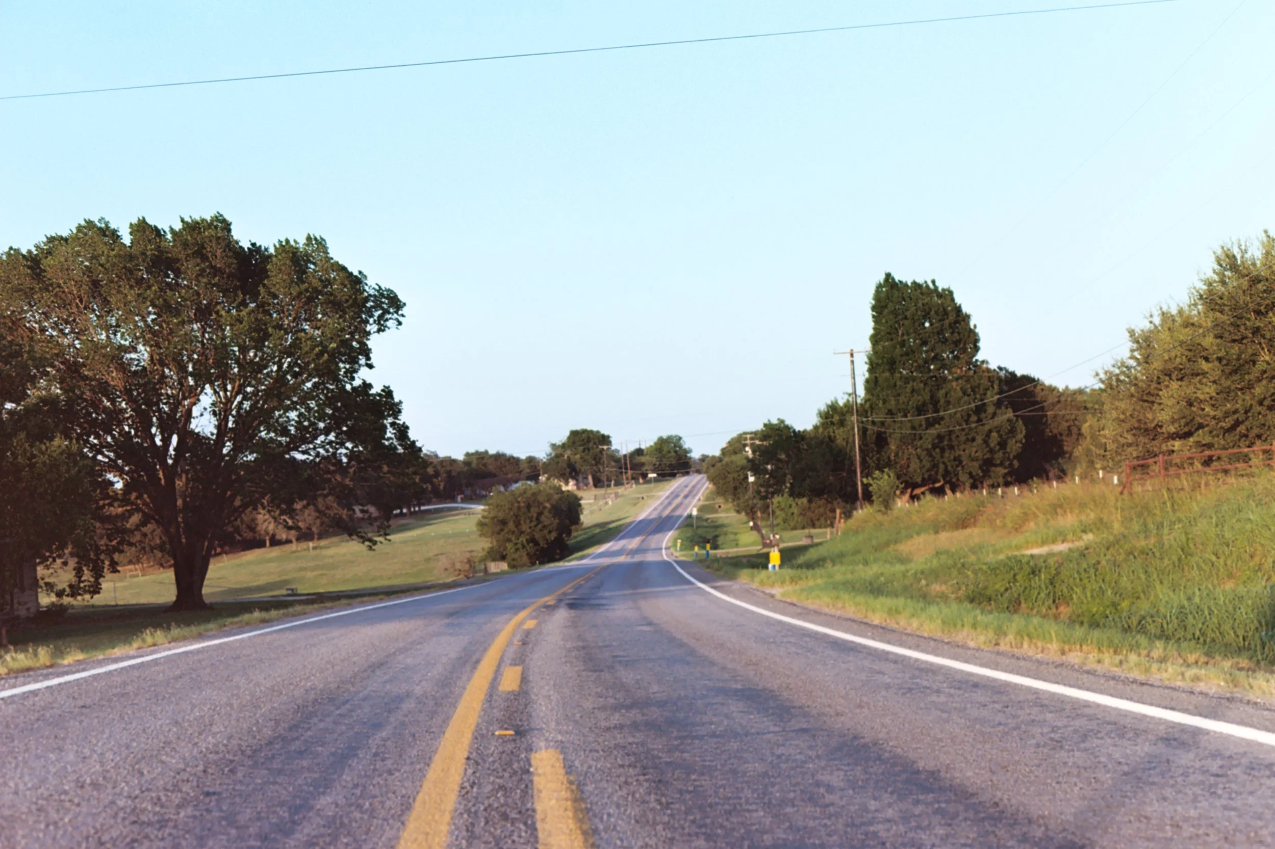 Scenic country road near Waco, Texas at sunset
