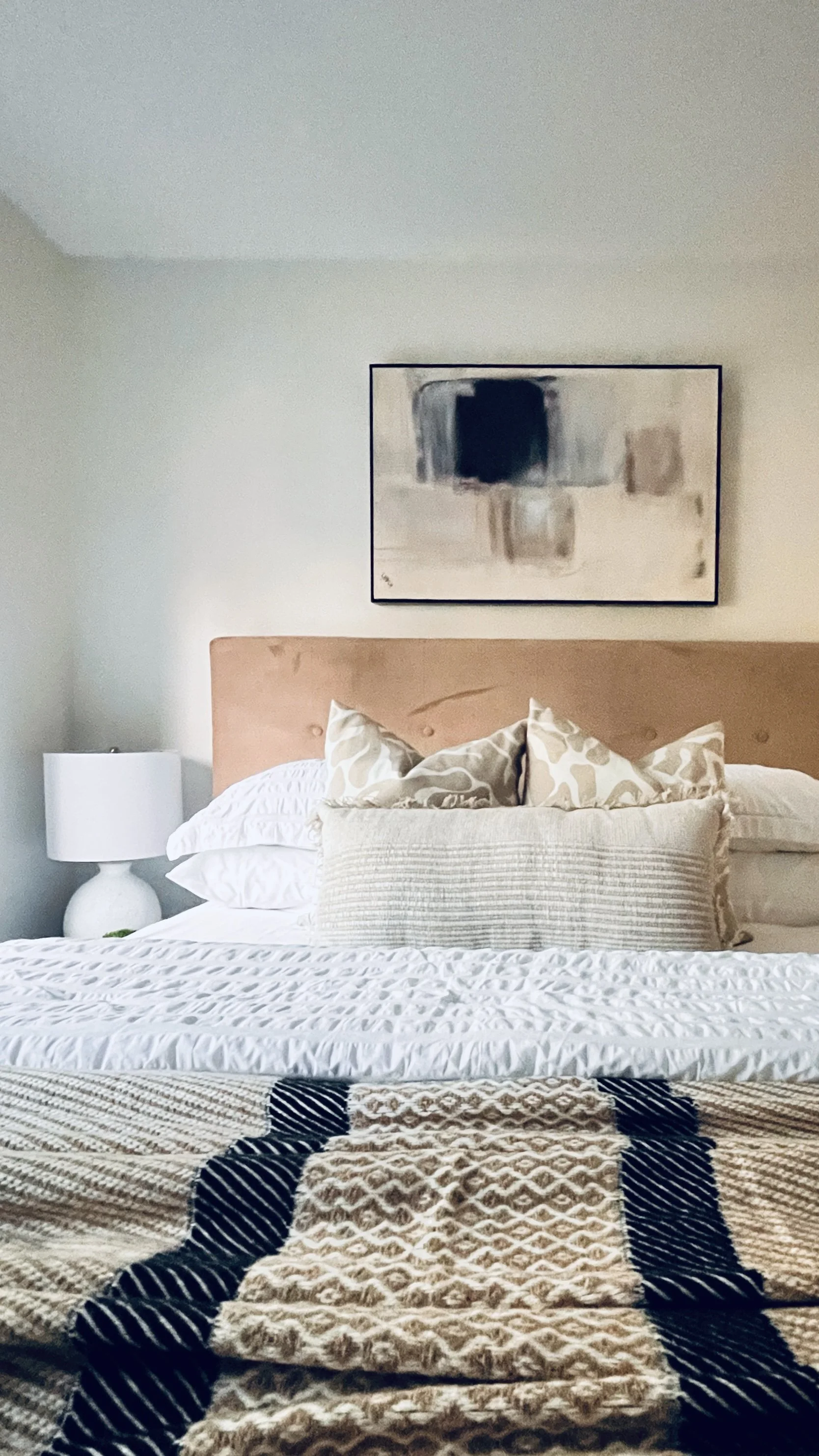 Cozy bedroom staging in a Blake-Jones pocket semi with warm neutral tones
