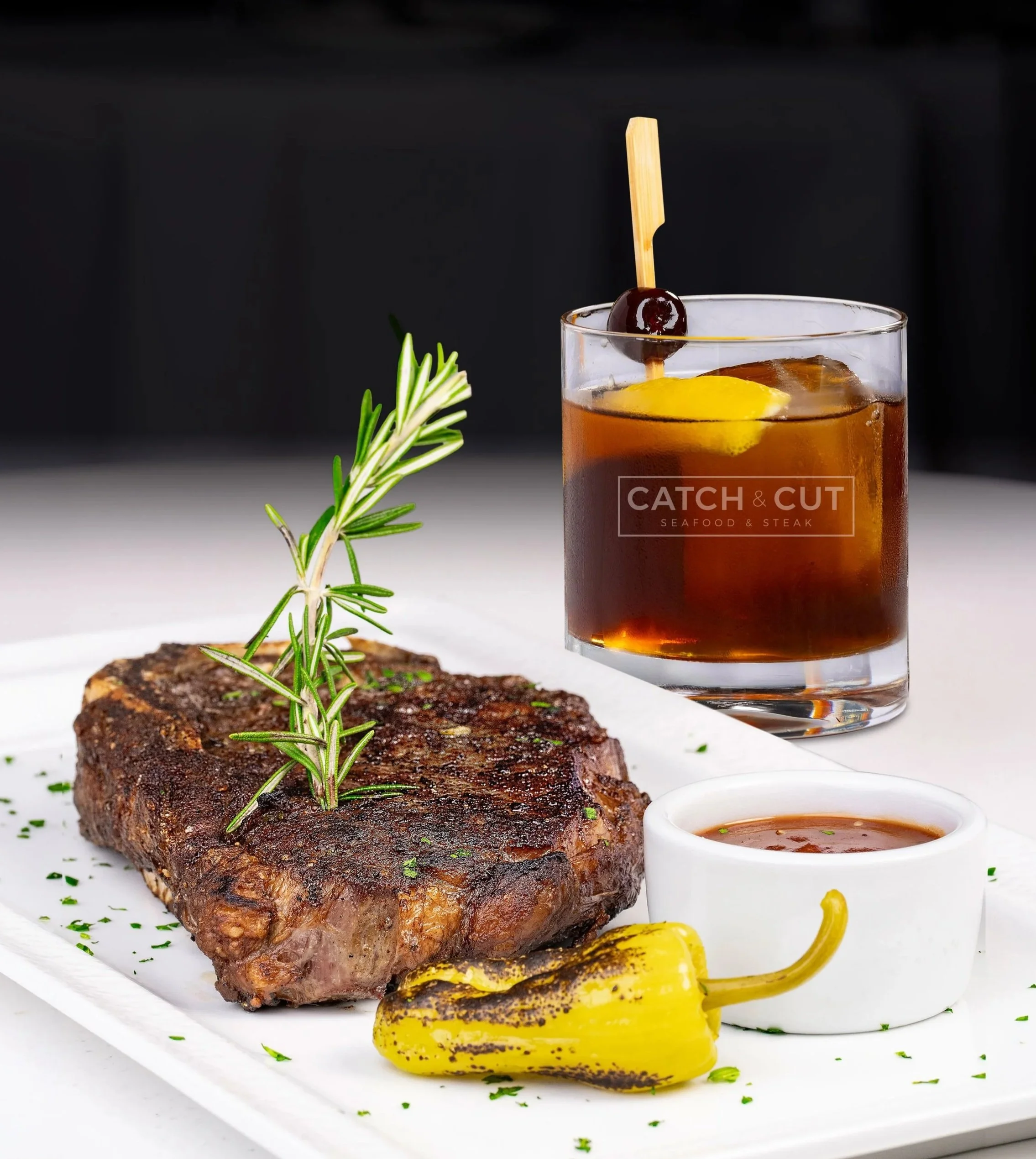 Father’s Day steak and whiskey promotion featuring a grilled steak and Catch & Cut branded whiskey cocktail.