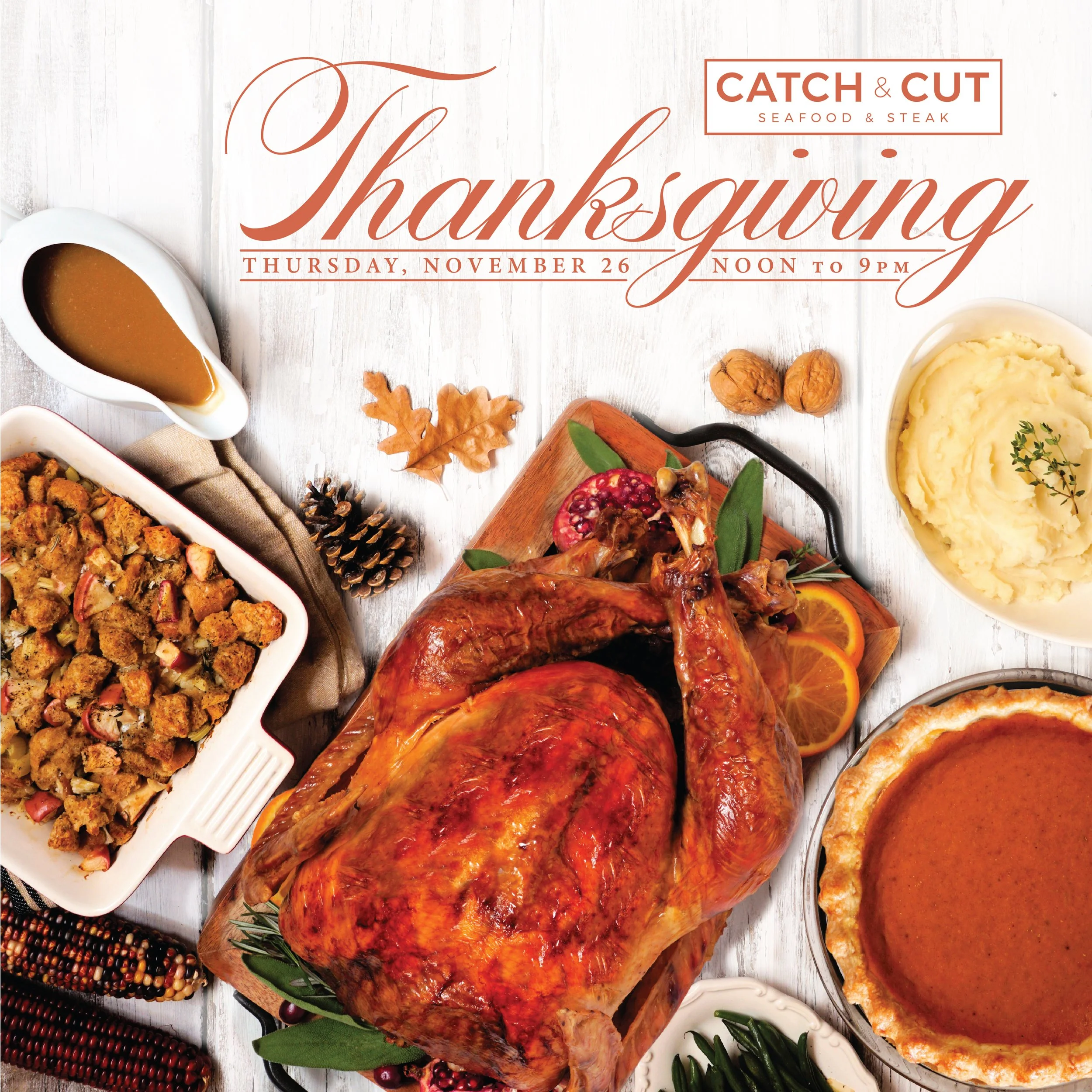 Thanksgiving at Catch & Cut. A table filled with various dishes for Thanksgiving, including roasted turkey, mashed potatoes, stuffing, cranberry sauce, and gravy.
