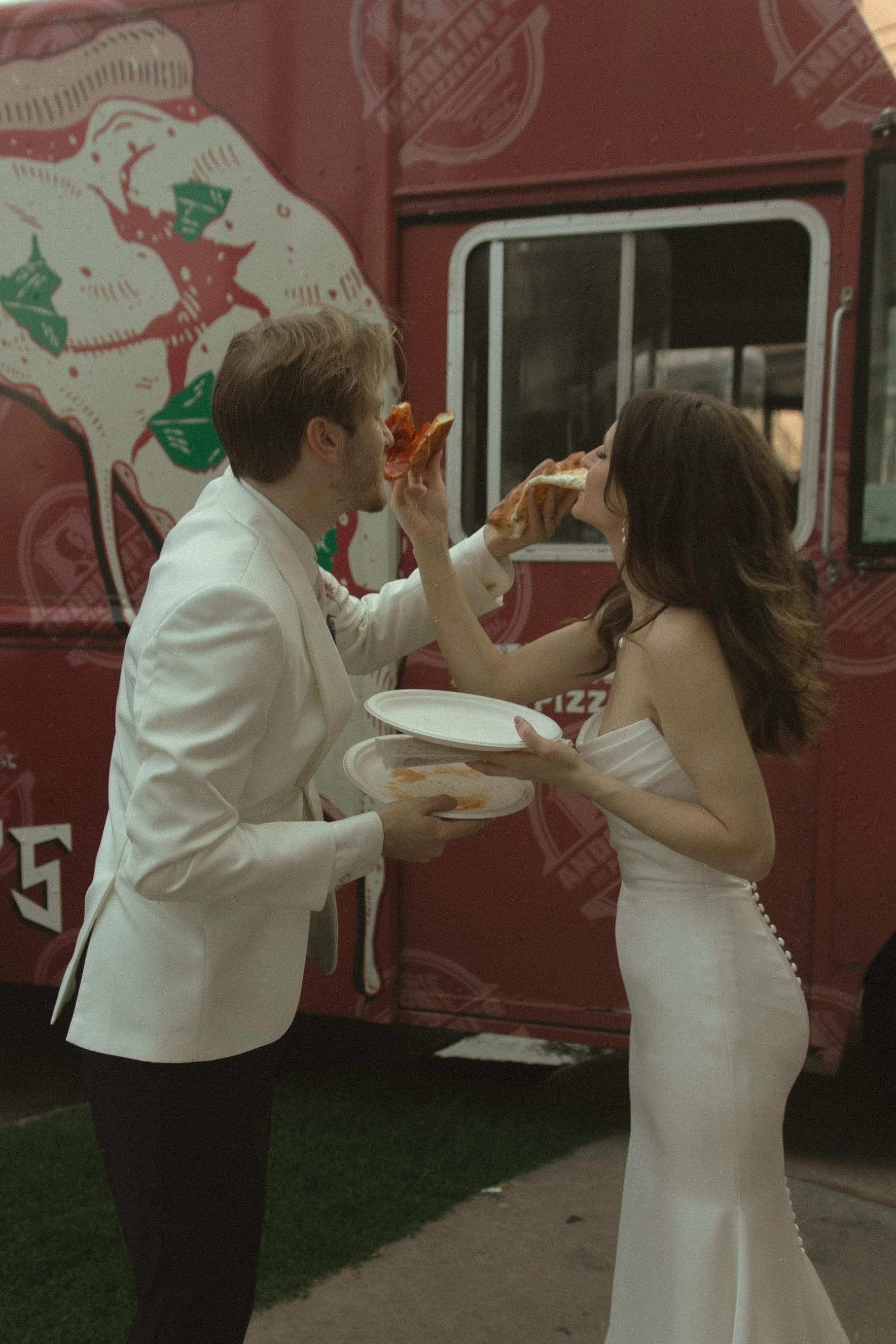 Tulsa Oklahoma wedding photographer capturing a candid reception moment with Andolini’s Pizza at The Canopy