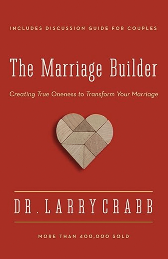 Book cover for "The Marriage Builder" by Dr. Larry Crabb, featuring a heart made of wooden puzzle pieces and the subtitle "Creating True Oneness to Transform Your Marriage."