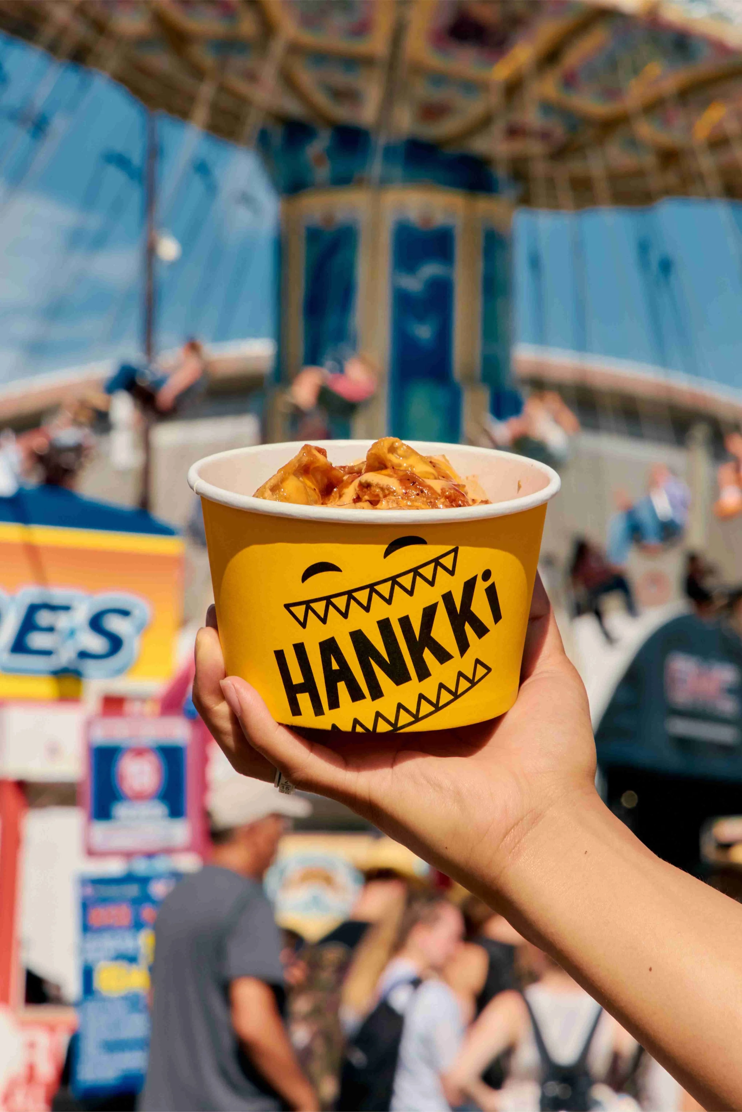 HANKKi Bowl held in front of a midway ride at Calgary Stampede 2026