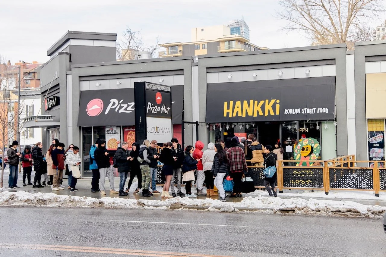 Wide view of a Hankki 17th Ave location during Charity Day 2025, showing strong community turnout and local support across Alberta