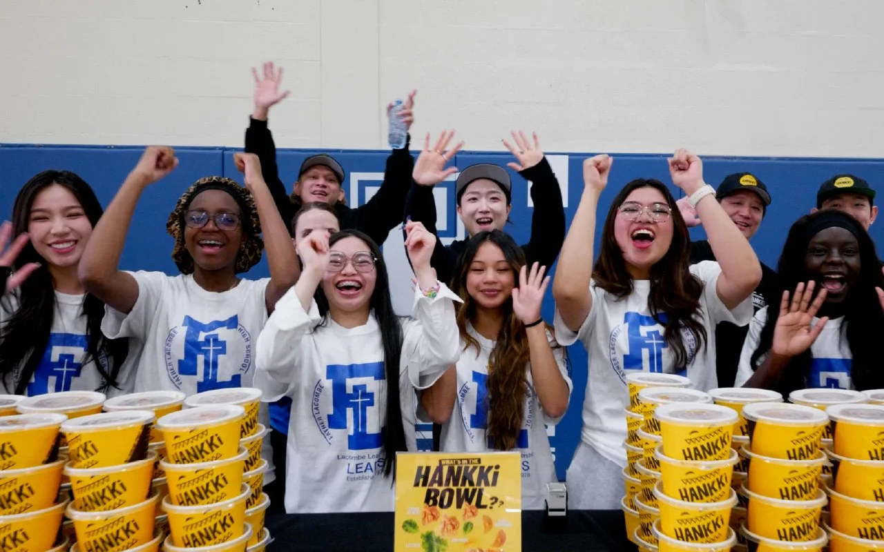 Students at Father Lacombe High School celebrating with HANKKi Bowls during a Calgary school event