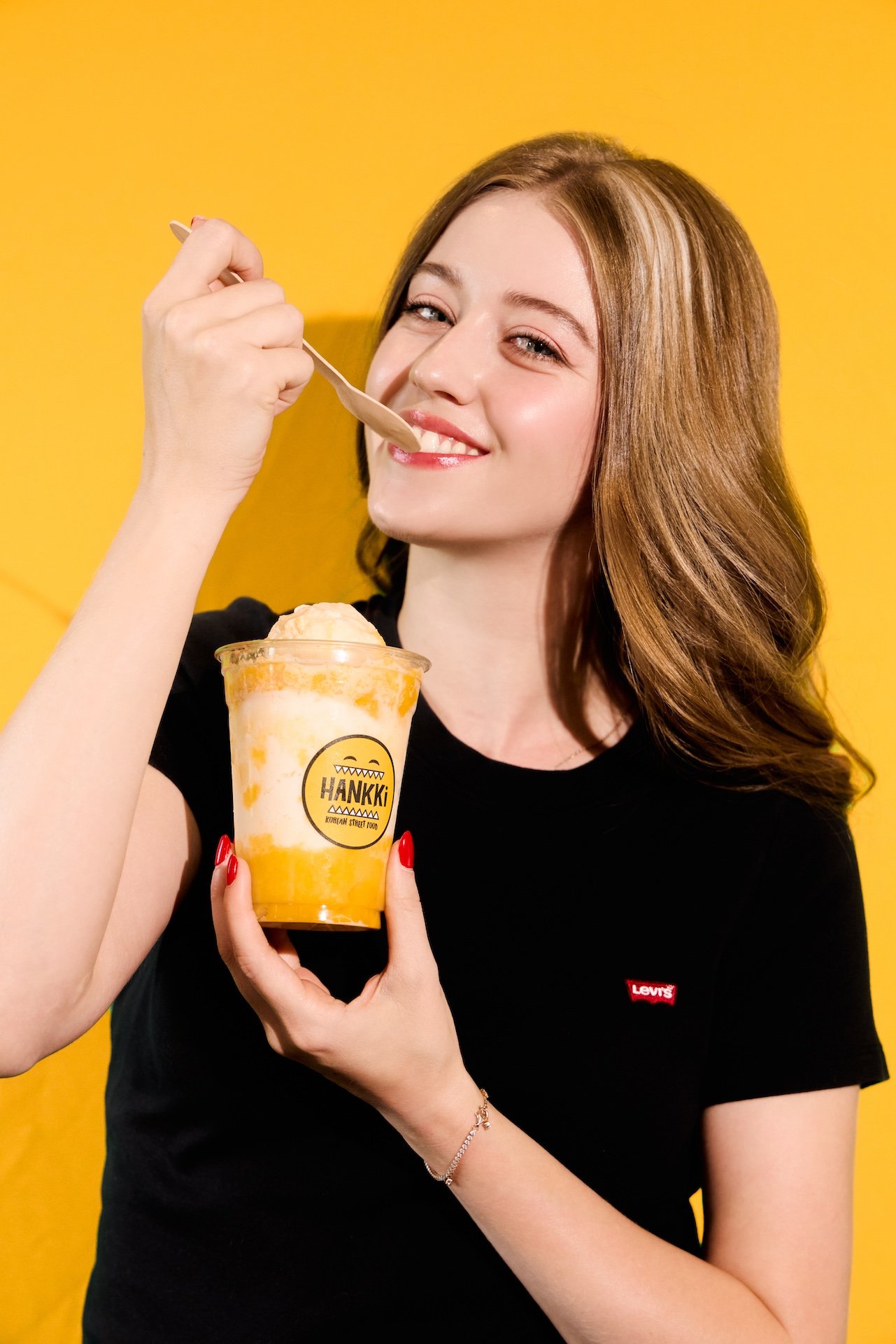 Customer enjoying HANKKi Mango Bingsu during summer in Calgary
