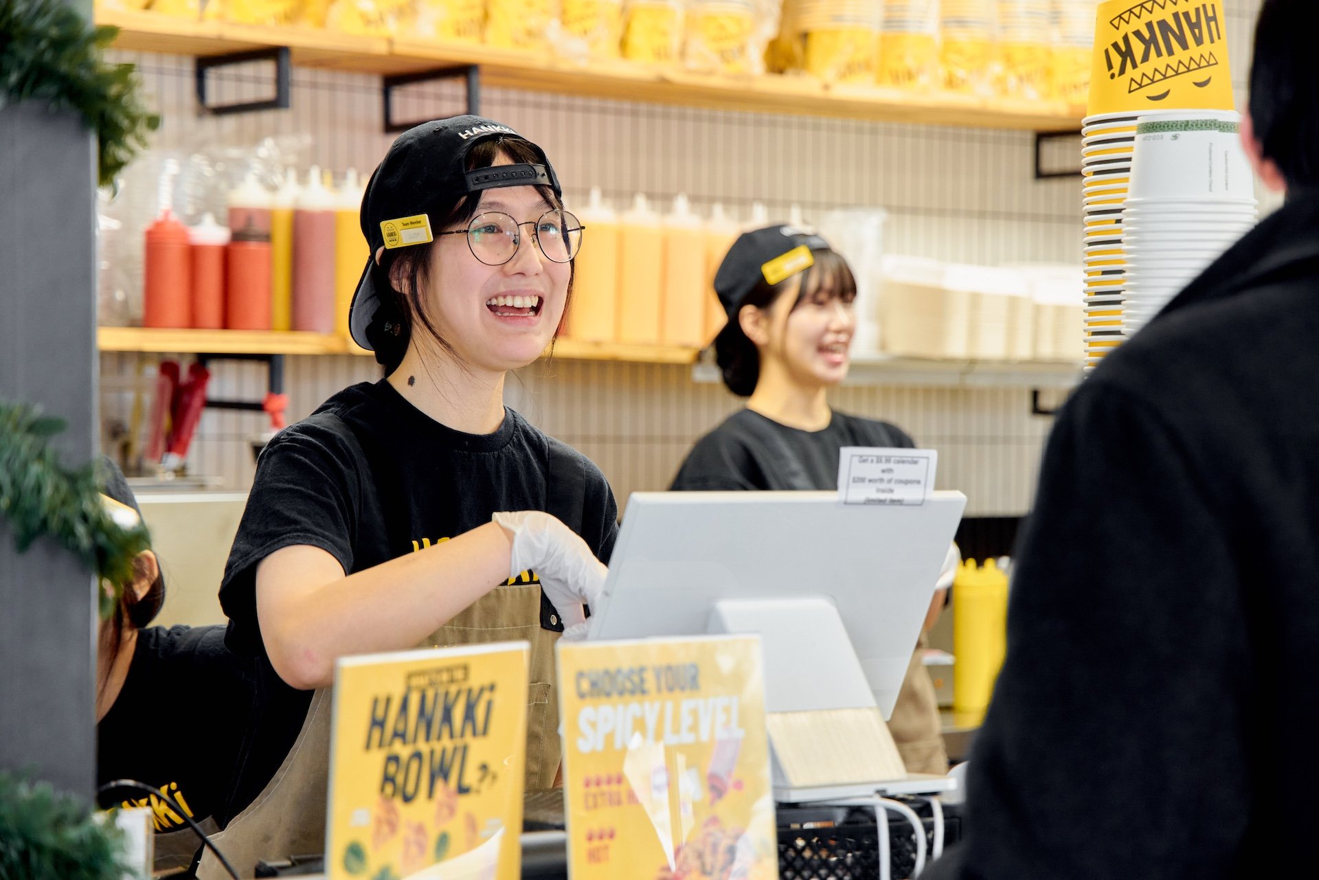 Hankki team members serving customers during Charity Day 2025, showing people-first service and community spirit