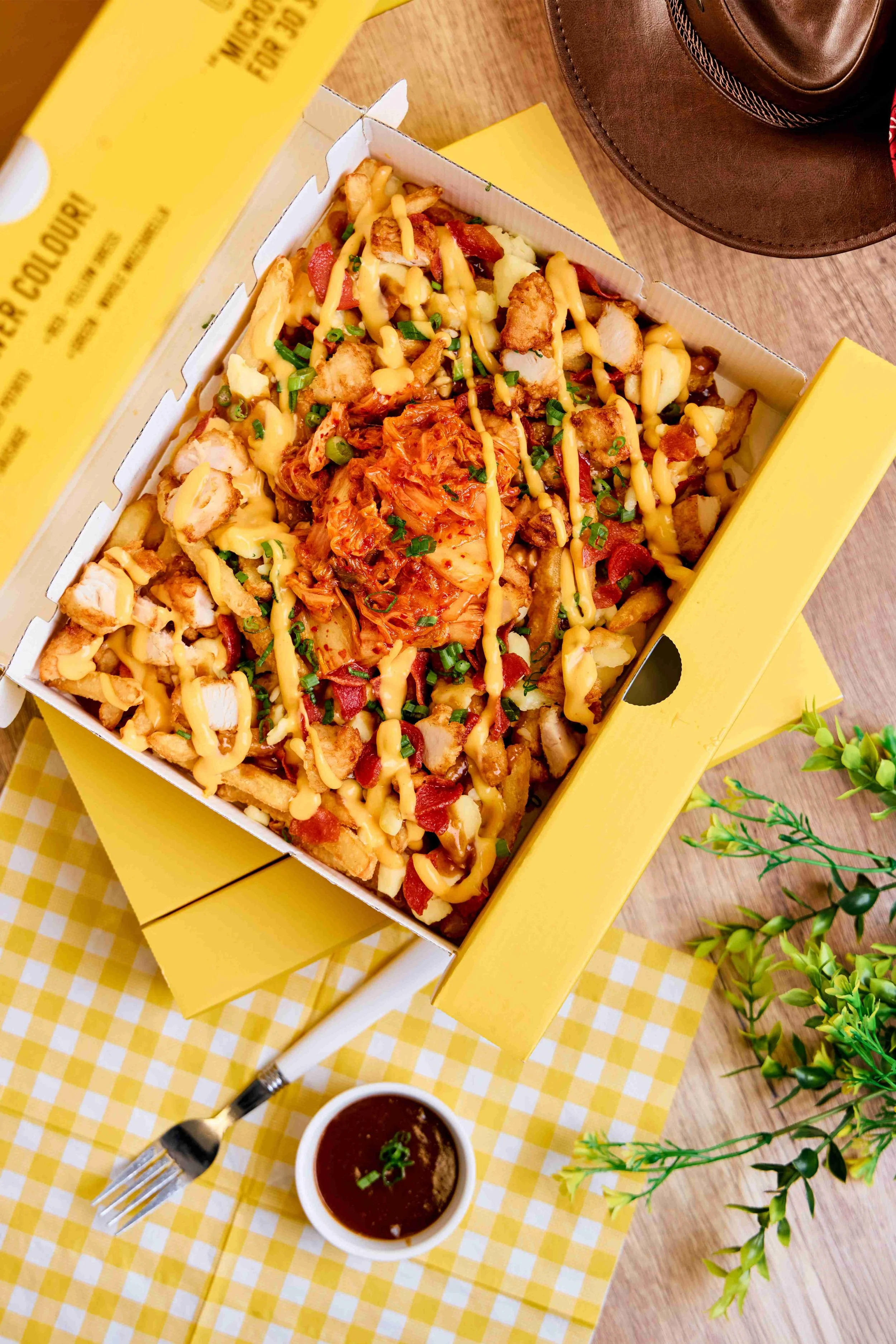 HANKKi Seoul Stampede Fries with kimchi, fries, chicken, sausage, cheese curds and sauce