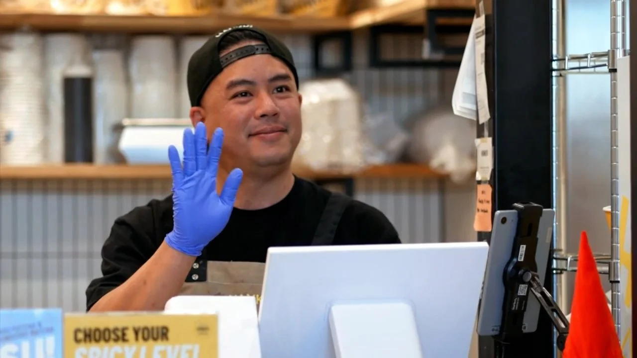 Friendly Hankki Forest Lawn staff providing warm customer service inside the Calgary restaurant
