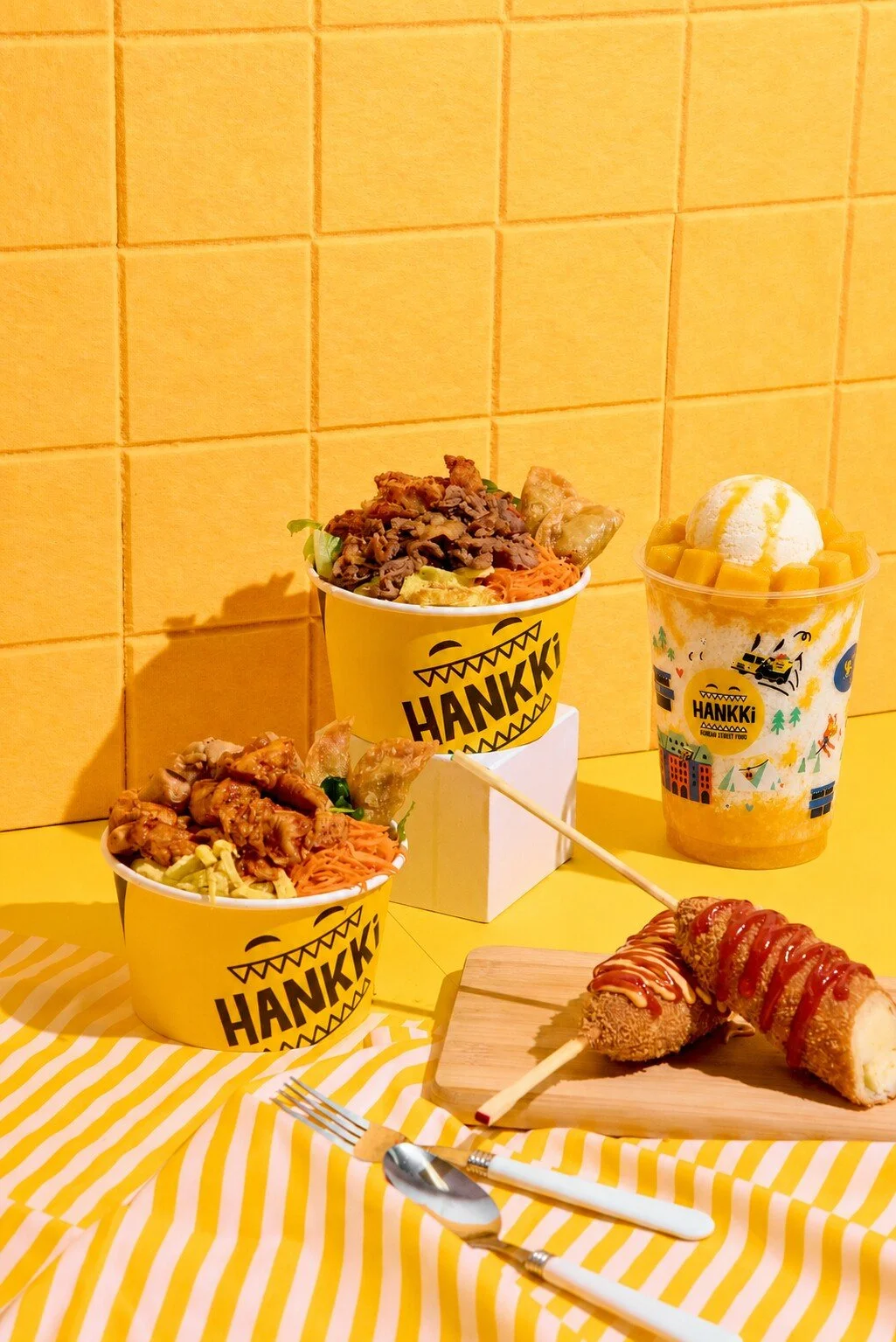 HANKKi Korean street food meal with bowls, Korean corn dogs and Mango Bingsu