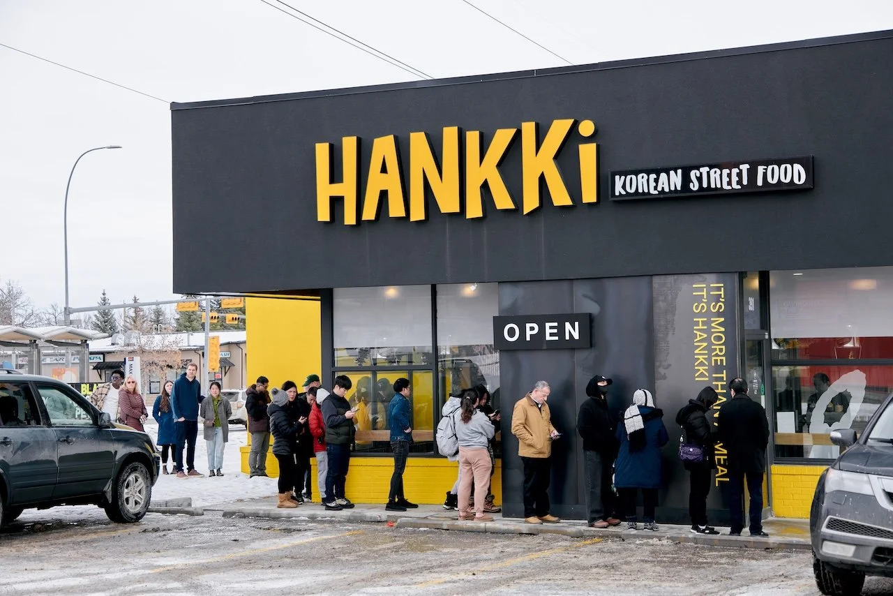Customers outside Hankki Acadia in Calgary, a local Korean street food restaurant known for repeat visits and community support