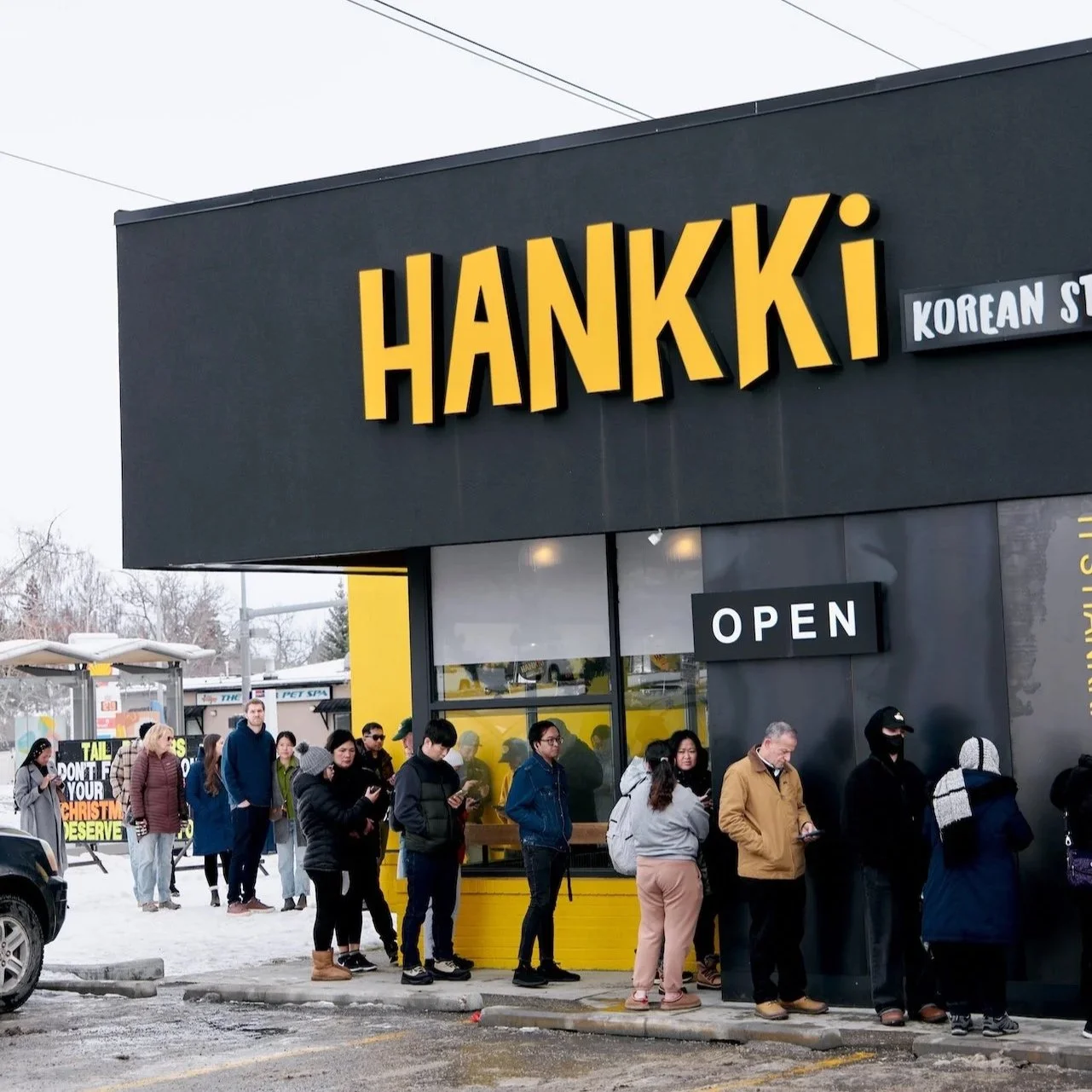 Customers lining up outside a Hankki Acadia location in Calgary during Charity Day 2025 to support the Giving Back the Love event