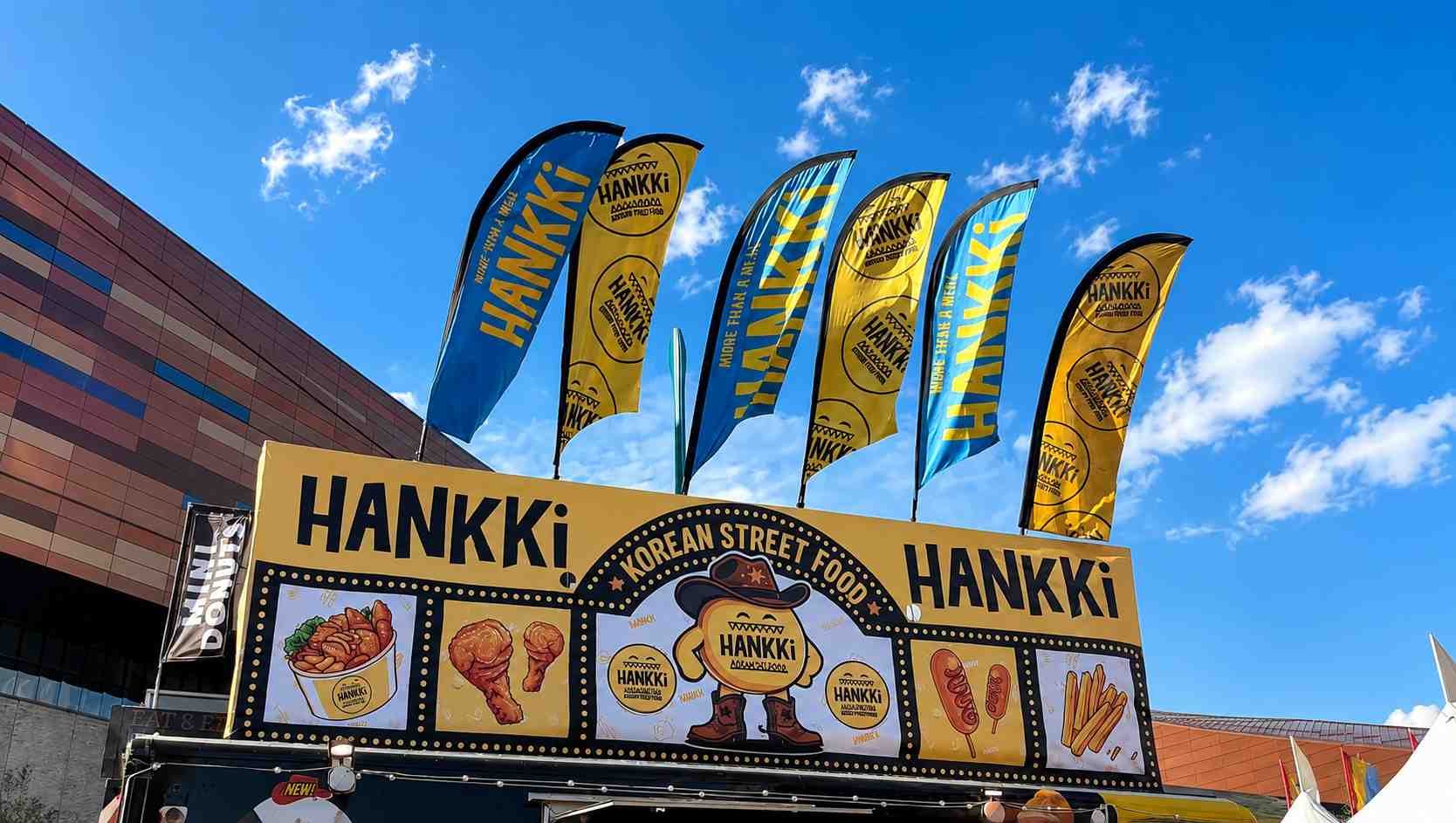 HANKKi Korean street food booth and branded flags at Calgary Stampede 2026