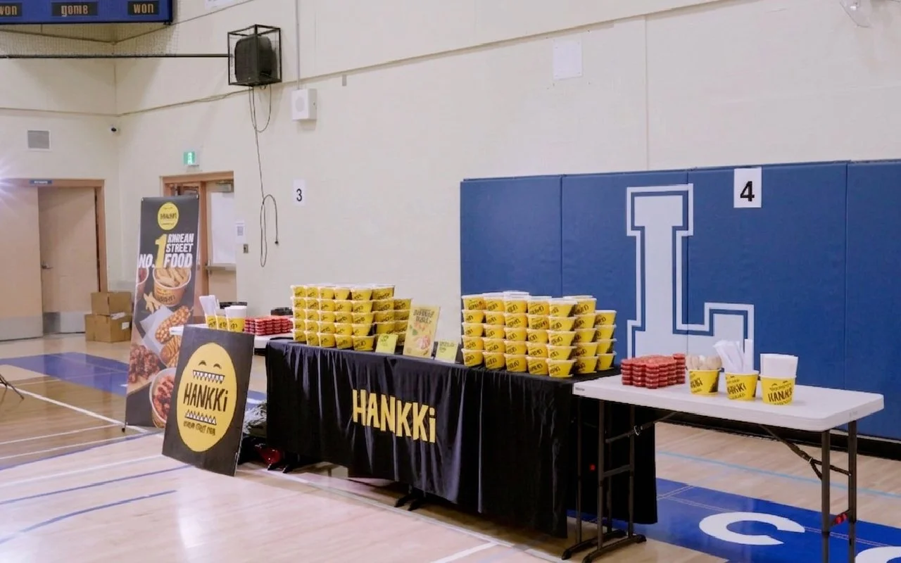 HANKKi food truck event setup inside the Father Lacombe High School gym during a Calgary snowstorm