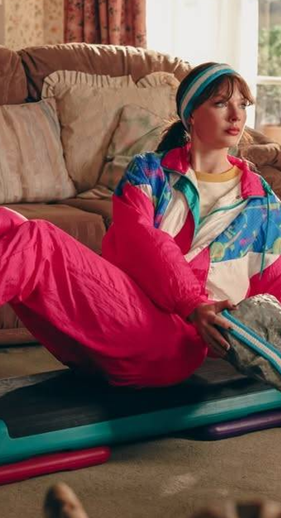 Taylor Swift dons retro 90s-inspired outfits including Reeboks in the "Opalite" music video.
