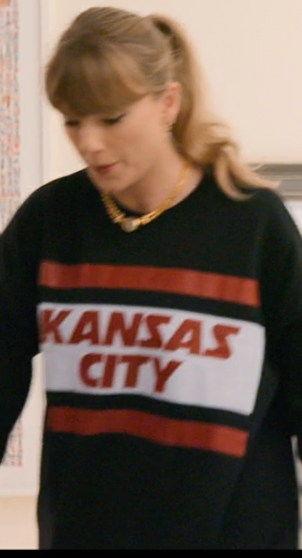 Taylor Swift during wardrobe fittings at the Eras Tour in her Disney+ docuseries The End of an Era wearing vintage Kansas City Chiefs wares.