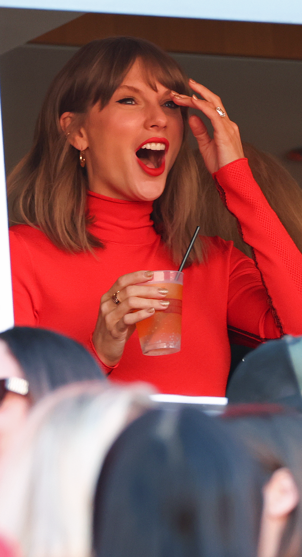Taylor Swift wears red Louis Vuitton to support husband Travis Kelce at Arrowhead Stadium Kansas City Chiefs.