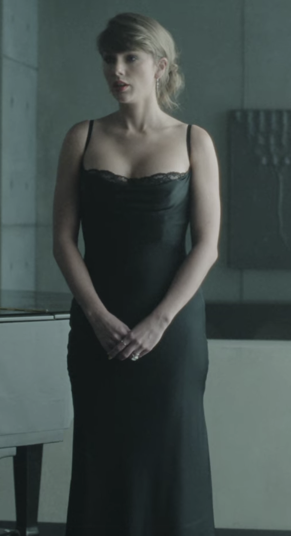 Taylor Swift in a silk and lace dress by Staud in the music video for "Patient Zero."