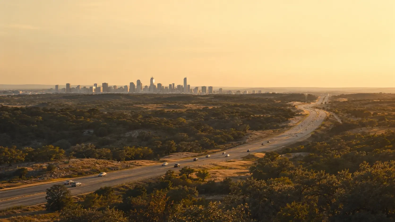 Highway 71 West at golden hour, looking east toward downtown Austin