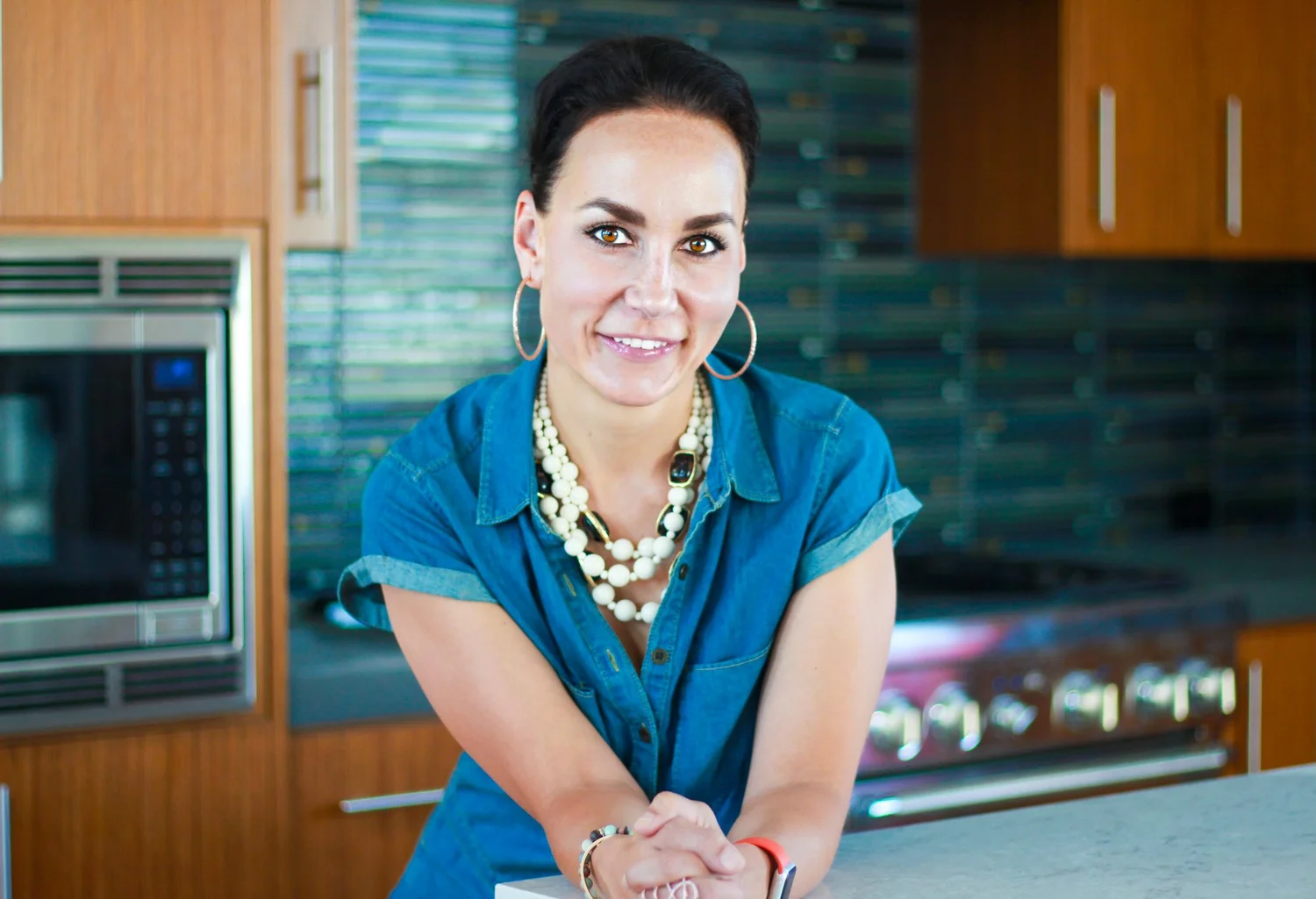 Diana Roberts, Austin Real Estate Advisor, in a home kitchen