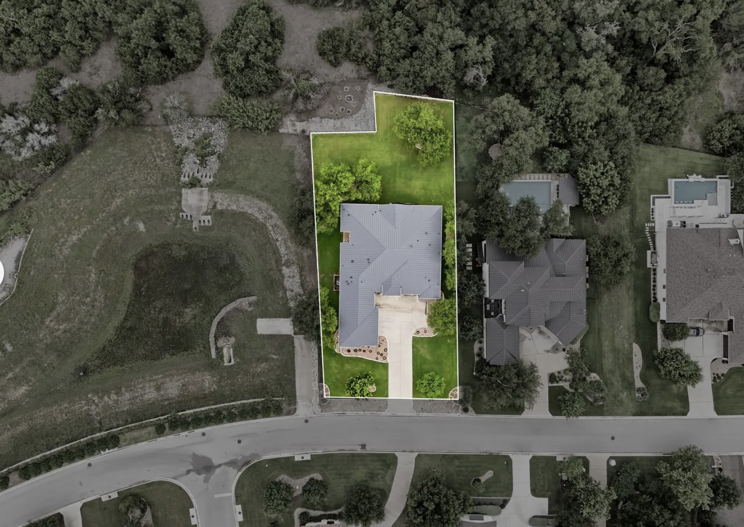 Aerial view of the 20,000-plus-square-foot Serene Hills homesite at 328 Ringtail Stream Drive