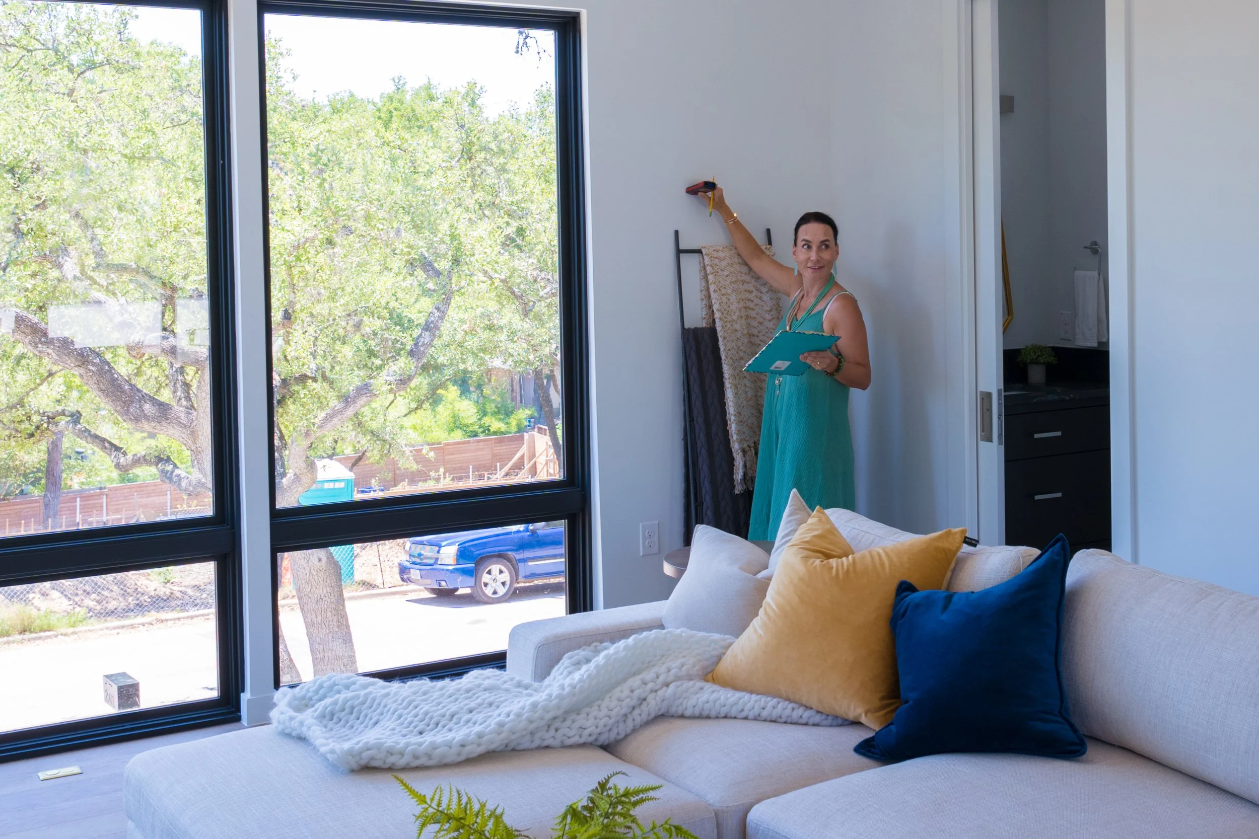 Diana Roberts measuring a property during an appraisal