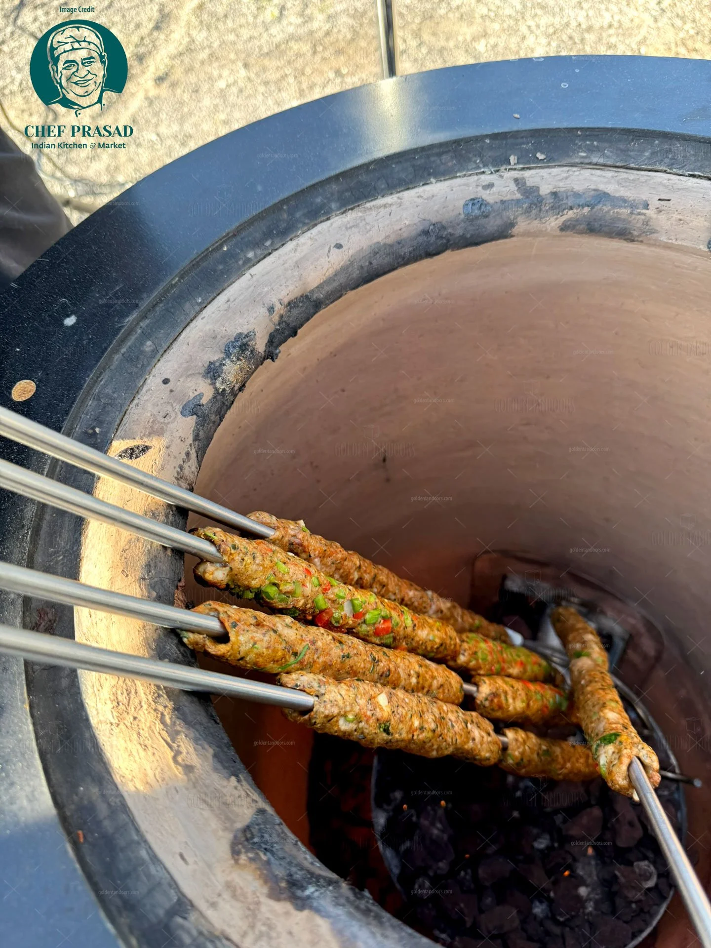 seekh kebab in catering tandoor on stainless steel skewers