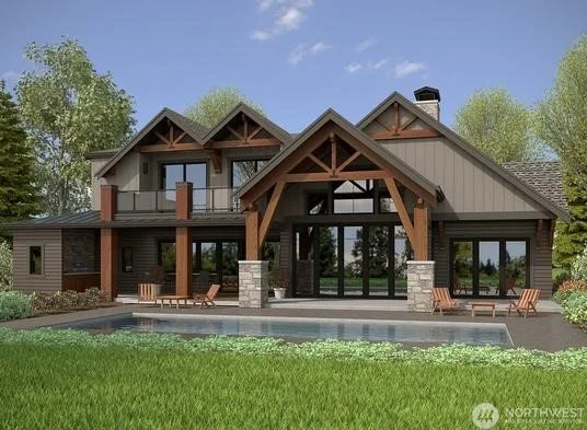 Modern house with large glass windows, wooden accents, and a swimming pool in the backyard surrounded by green grass and trees.